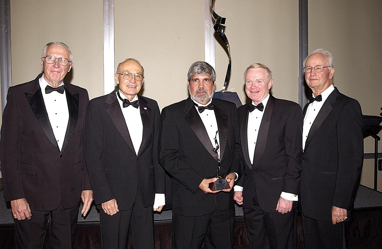 KENNEDY SPACE CENTER, FLA. --  Winners of the Dr. Kurt H. Debus Award attending the 2003 awards dinner are (from left) Lee Solid, Robert B. Sieck, Adrian Laffitte, Roy D. Bridges, and Dr. Maxwell King.  Laffitte, director of Atlas Programs for Lockheed Martin Astronautics at Cape Canaveral Air Force Station, was honored as the winner of the 2003 Dr. Kurt H. Debus Award from the National Space Club Florida Committee. The Debus Award was created by the committee to recognize significant achievements and contributions made in Florida to American aerospace efforts.