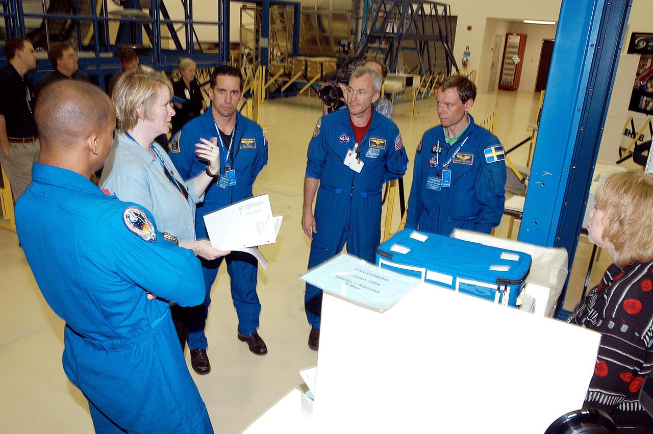 KENNEDY SPACE CENTER, FLA. - The STS-116 crew takes part in training at SPACEHAB in Port Canaveral, Fla. From left are Mission Specialist Robert Curbeam, Pilot William Oefelein, Commander Terrence Wilcutt and Mission Specialist Christer Fuglesang. Objective of their mission to the International Space Station is to deliver and attach the third port truss segment, the P5 Truss, deactivate and retract the P6 Truss Channel 4B (port-side) solar array, and reconfigure station power from 2A and 4A solar arrays. A launch date is under review.