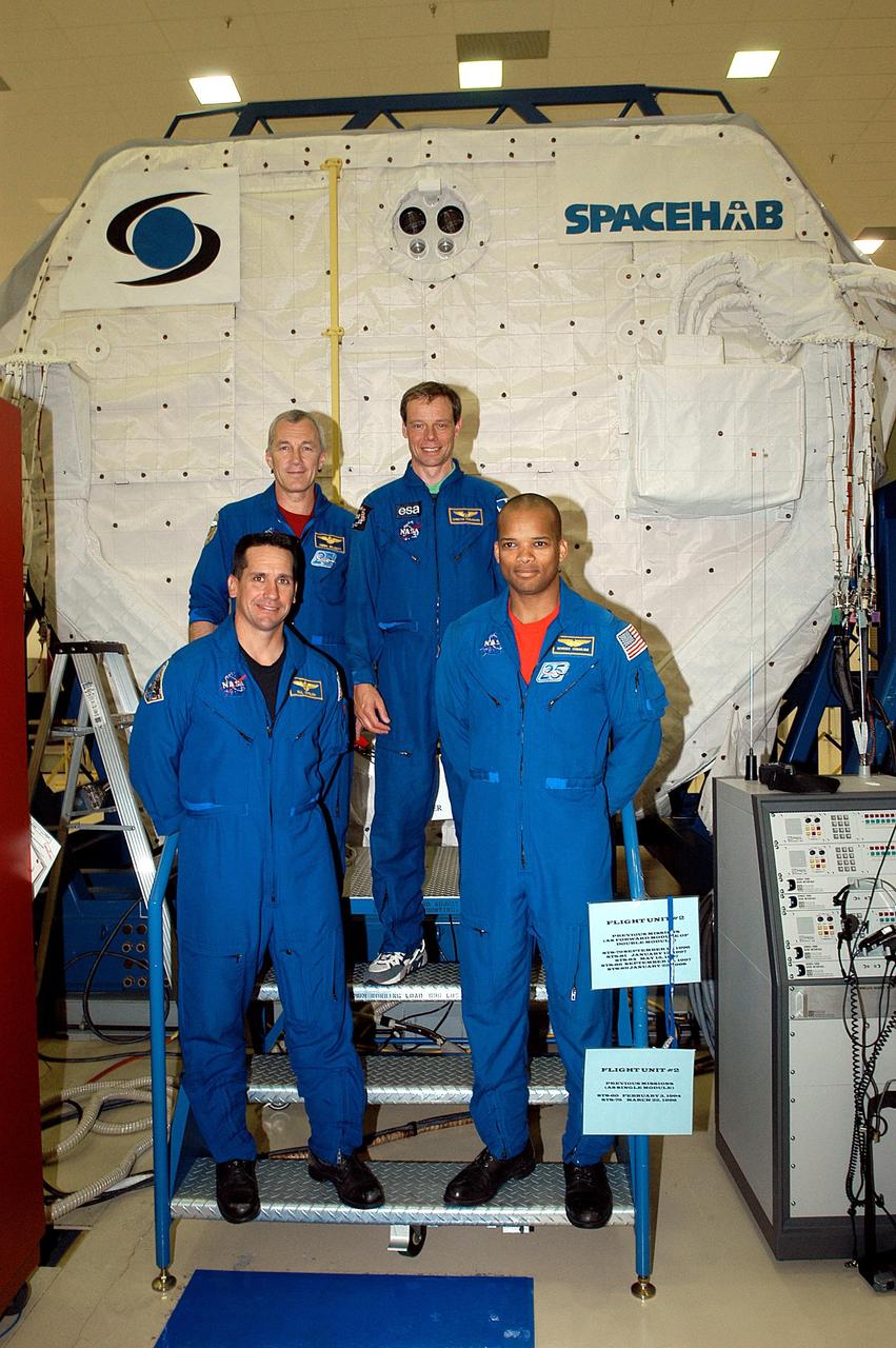KENNEDY SPACE CENTER, FLA. -- The STS-116 crew poses outside the SPACEHAB module during training. In the rear are Commander Terrence Wilcutt and Mission Specialist Christer Fuglesang;; in front are Pilot William Oefelein and Mission Specialist Robert Curbeam. Objective of their mission to the International Space Station is to deliver and attach the third port truss segment, the P5 Truss, deactivate and retract the P6 Truss Channel 4B (port-side) solar array, and reconfigure station power from 2A and 4A solar arrays. A launch date is under review.