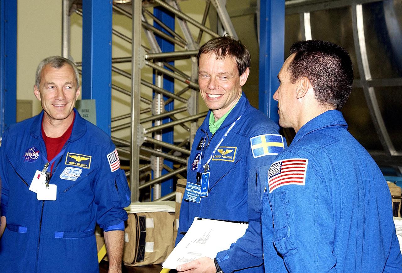 KENNEDY SPACE CENTER, FLA. - During a break in training at SPACEHAB, Port Canaveral, Fla., STS-116 Commander Terrence Wilcutt, Mission Specialist Christer Fuglesang and Pilot Michael Oelefein share a laugh. Not seen is Mission Specialist Robert Curbeam. Objective of their mission to the International Space Station is to deliver and attach the third port truss segment, the P5 Truss, deactivate and retract the P6 Truss Channel 4B (port-side) solar array, and reconfigure station power from 2A and 4A solar arrays. A launch date is under review.