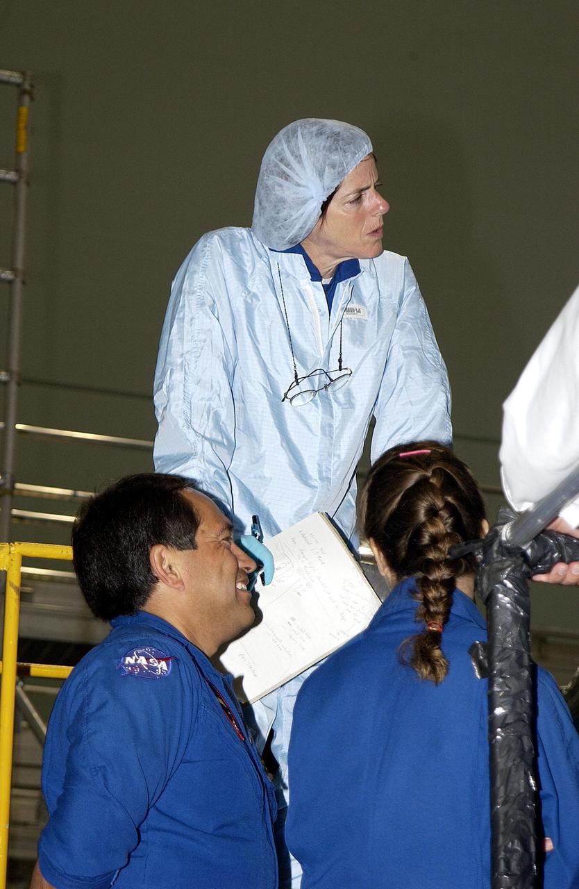 KENNEDY SPACE CENTER, FLA. - In the Space Station Processing Facility, the STS-118 crew take part in training on equipment for their mission.  Mission Specialist Barbara Morgan (above) looks at equipment.  Below are STS-119 Mission Specialist Carlos Noriega (left) and STS-118 Mission Specialist Lisa Nowak.  The STS-118 mission will be delivering the third starboard truss segment, the ITS S5, to the International Space Station, and a SPACEHAB Single Cargo Module with supplies and equipment.  Launch date is under review.