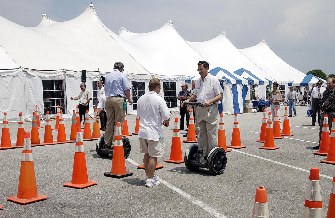 KENNEDY SPACE CENTER, FLA. - During Energy and Awareness Week, employees try out the Segway Human Transporter, a self-balancing, electric-powered transportation device.  Narrower than a standard doorway, the Segway is clean and quiet, with zero emissions.  The two-day event was held April 22-23 around the Center.