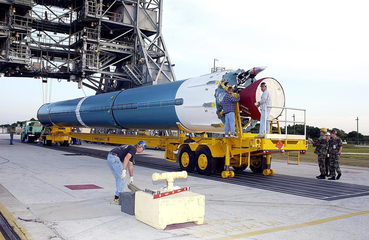 KENNEDY SPACE CENTER, FLA. -  The first stage of the Delta II rocket to launch the MER-A (Mars Exploration Rover) vehicle arrives at Pad 17-A on Cape Canaveral Air Force Station. The MER Mission consists of two identical rovers designed to cover roughly 110 yards each Martian day over various terrain. Each rover will carry five scientific instruments that will allow it to search for evidence of liquid water that may have been present in the planet's past.  Identical to each other, the rovers will land at different regions of Mars.  Launch date for this first of NASA's two Mars Exploration Rover missions is scheduled no earlier than June 6.