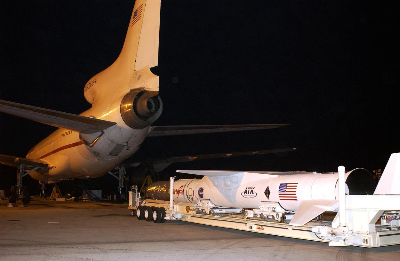 KENNEDY SPACE CENTER, FLA. - The mated Pegasus XL and Galaxy Evolution Explorer (GALEX) satellite approach the Orbital Sciences L-1011 aircraft at Cape Canaveral Air Force Station.  The GALEX, to be launched April 28 from the L-1011, will carry into space an orbiting telescope that will observe a million galaxies across 10 billion years of cosmic history to help astronomers determine when the stars and elements we see today had their origins. The spacecraft will sweep the skies for 28 months using state-of-the-art ultraviolet detectors to single out galaxies dominated by young, hot, short-lived stars that give off a great deal of energy at that wavelength.  These galaxies are actively creating stars, and therefore provide a window into the history and causes of star formation in galaxies.