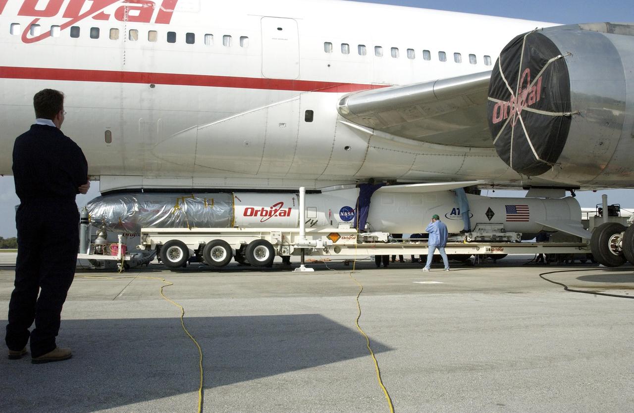 KENNEDY SPACE CENTER, FLA. - At Cape Canaveral Air Force Station, the Pegasus XL and Galaxy Evolution Explorer (GALEX) satellite are mated to the Orbital Sciences L-1011 aircraft.  The GALEX, to be launched April 28 from the L-1011, will carry into space an orbiting telescope that will observe a million galaxies across 10 billion years of cosmic history to help astronomers determine when the stars and elements we see today had their origins. The spacecraft will sweep the skies for 28 months using state-of-the-art ultraviolet detectors to single out galaxies dominated by young, hot, short-lived stars that give off a great deal of energy at that wavelength.  These galaxies are actively creating stars, and therefore provide a window into the history and causes of star formation in galaxies.