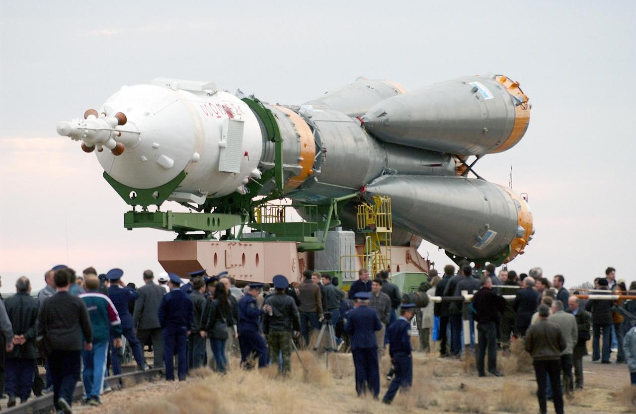 Baikonur Cosmodrome, Kazakhstan -- The Soyuz rocket is rolled out of the assembly building and travels via rail to the launch pad.  Expedition Seven is scheduled to launch onboard the Soyuz April 26, 2003. Cosmonaut Yuri Malenchenko, commander, and astronaut Ed Lu, NASA science officer and flight engineer, were named as the primary crew, Expedition 7, for the launch to the International Space Station. Russian cosmonaut Alexander Kaleri and NASA astronaut Michael Foale are the backup crewmembers to Malenchenko and Lu.  Expedition 6 Commander Ken Bowersox, Flight Engineer Nikolai Budarin and NASA Space Station Science Officer Don Pettit will return to Earth aboard the Soyuz TMA-1 craft in May 2003. The three Expedition 6 crewmembers were launched on Nov. 23, 2002. They have been aboard the Station since November 25. They were originally scheduled to return in March aboard the Space Shuttle Atlantis during the STS-114 mission.  Malenchenko and Lu will continue to operate the science payloads already on board, as well as maintaining the Station.  Photo Credit: NASA/Bill Ingalls