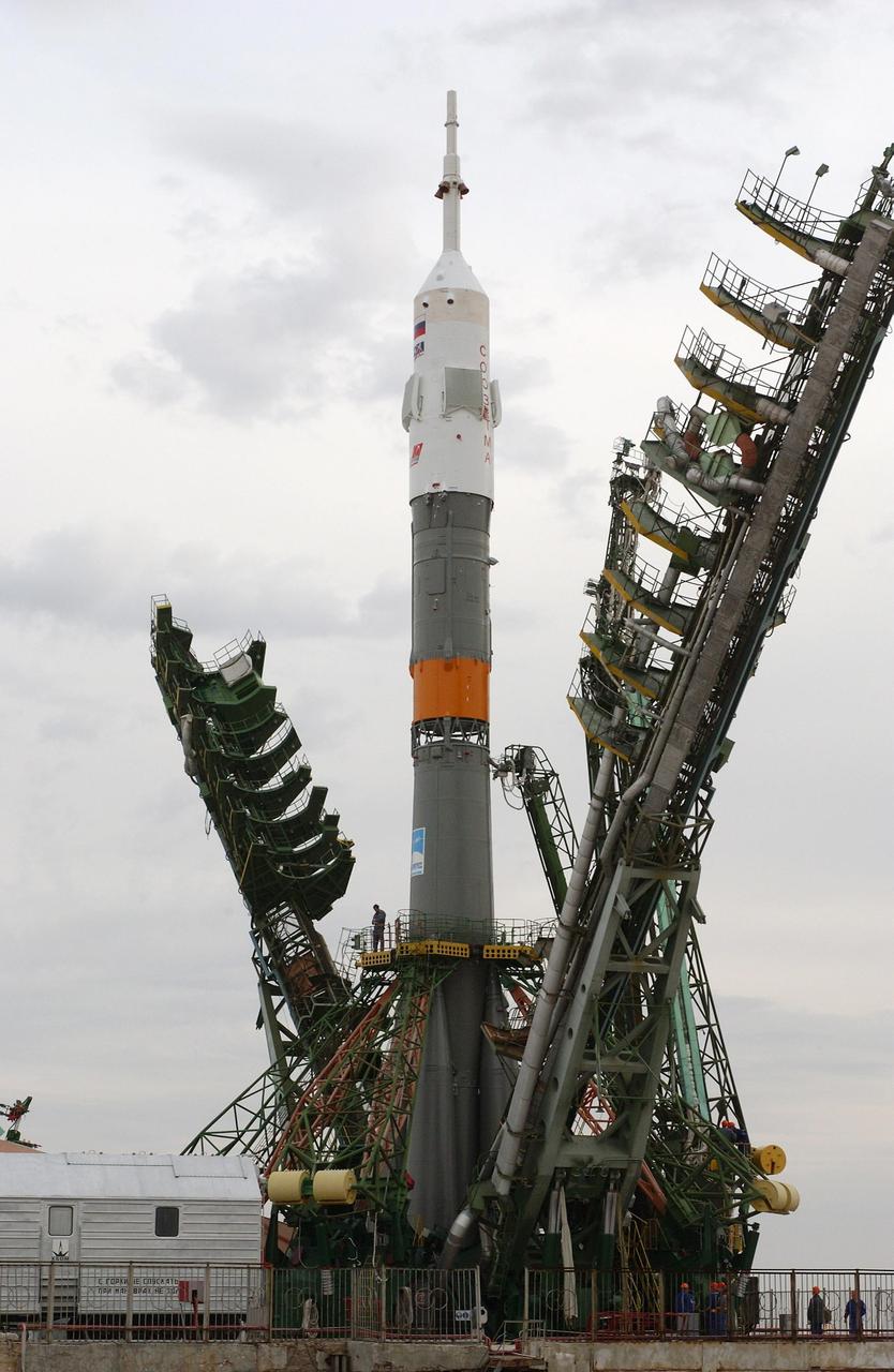 Baikonur Cosmodrome, Kazakhstan -- The Russian Soyuz TMA-2 rocket is erected at the launch pad. Expedition Seven is scheduled to launch onboard the Soyuz April 26, 2003. Veteran Russian cosmonaut Yuri Malenchenko and veteran NASA astronaut Ed Lu were named as the primary crew for the launch to the International Space Station. Russian cosmonaut Alexander Kaleri and NASA astronaut Michael Foale are the backup crewmembers to Malenchenko and Lu. Expedition 6 Commander Ken Bowersox, Flight Engineer Nikolai Budarin and NASA Space Station Science Officer Don Pettit will return to Earth aboard the Soyuz TMA-1 craft in May 2003. The three Expedition 6 crewmembers were launched on Nov. 23, 2002. They have been aboard the Station since November 25. They were originally scheduled to return in March aboard the Space Shuttle Atlantis during the STS-114 mission. Malenchenko and Lu will continue to operate the science payloads already on board, as well as maintaining the Station. Photo Credit: NASA/Bill Ingalls