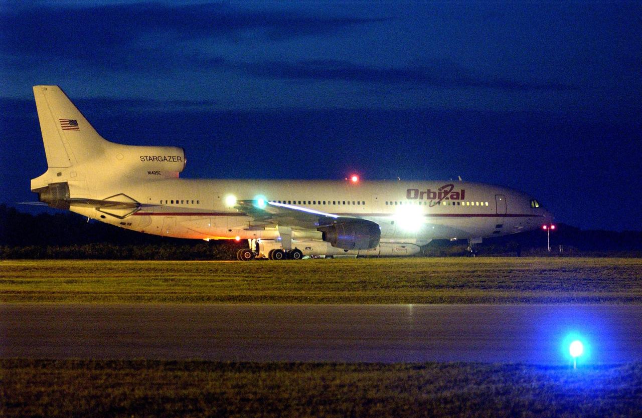 KENNEDY SPACE CENTER, FLA. -  In the early morning hours at Cape Canaveral Air Force Station, Orbital Sciences' L-1011 aircraft waits for takeoff time between 7:50 and 9:50 a.m. EDT.  Attached underneath is the Pegasus XL rocket with its payload, the Galaxy Evolution Explorer (GALEX), due to be released about 8 a.m.  The GALEX will carry into space an orbiting telescope that will observe a million galaxies across 10 billion years of cosmic history to help astronomers determine when the stars and elements we see today had their origins. The spacecraft will sweep the skies for 28 months using state-of-the-art ultraviolet detectors to single out galaxies dominated by young, hot, short-lived stars that give off a great deal of energy at that wavelength.  These galaxies are actively creating stars, and therefore provide a window into the history and causes of star formation in galaxies.