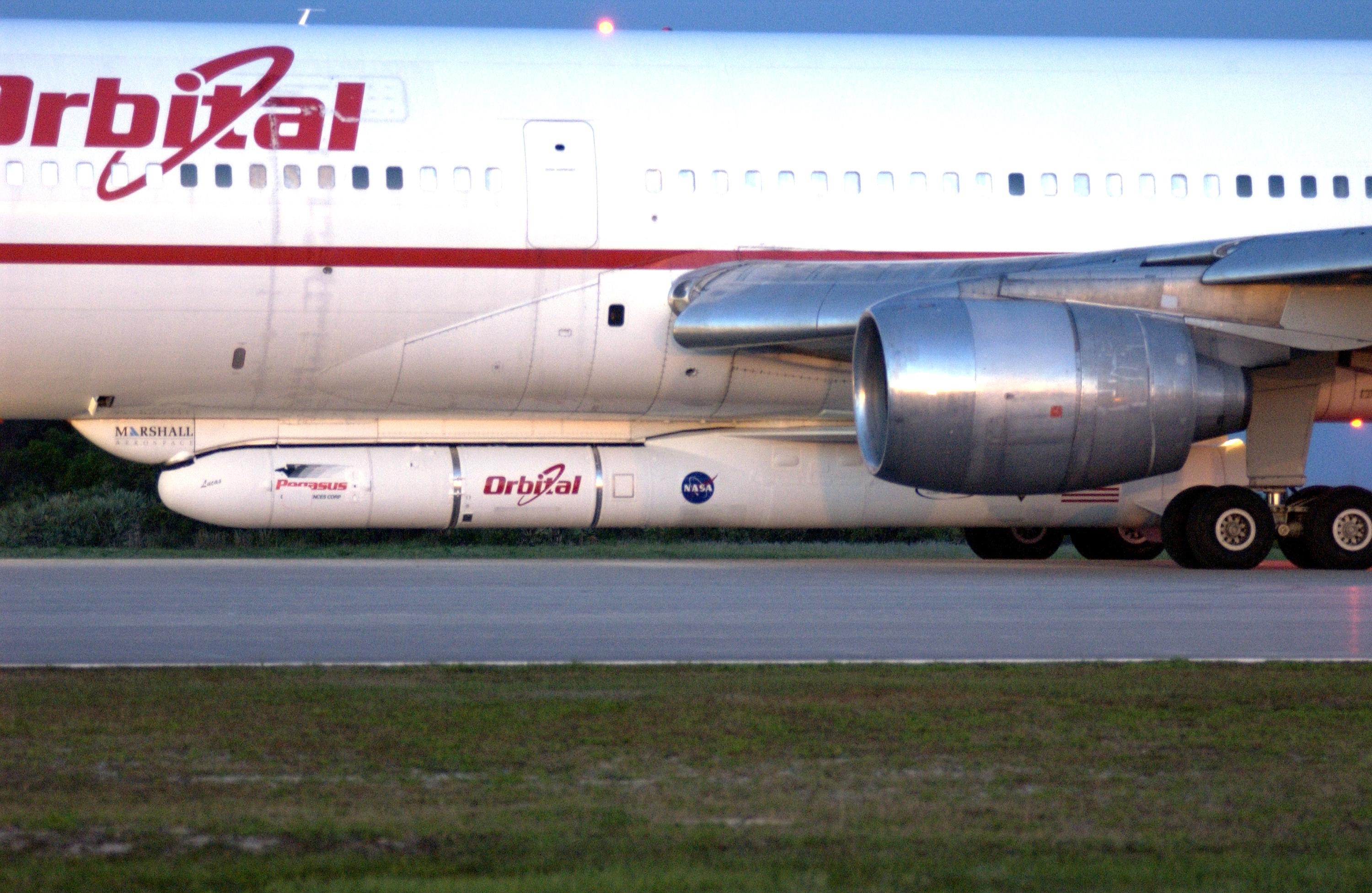 KENNEDY SPACE CENTER, FLA. - At Cape Canaveral Air Force Station, Orbital Sciences' L-1011 aircraft waits for takeoff time between 7:50 and 9:50 a.m. EDT.  Attached underneath is the Pegasus XL rocket with its payload, the Galaxy Evolution Explorer (GALEX), due to be released about 8 a.m.  The GALEX will carry into space an orbiting telescope that will observe a million galaxies across 10 billion years of cosmic history to help astronomers determine when the stars and elements we see today had their origins. The spacecraft will sweep the skies for 28 months using state-of-the-art ultraviolet detectors to single out galaxies dominated by young, hot, short-lived stars that give off a great deal of energy at that wavelength.  These galaxies are actively creating stars, and therefore provide a window into the history and causes of star formation in galaxies.