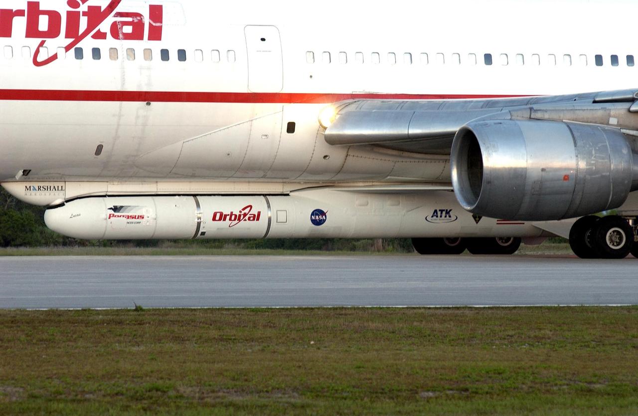 KENNEDY SPACE CENTER, FLA. -  Orbital Sciences' L-1011 aircraft carries the Pegasus XL rocket/Galaxy Evolution Explorer (GALEX) under its belly.  The aircraft is scheduled for takeoff in a window beginning at 7:50 a.m. and release of the Pegasus about 8 a.m.  The GALEX will carry into space an orbiting telescope that will observe a million galaxies across 10 billion years of cosmic history to help astronomers determine when the stars and elements we see today had their origins. The spacecraft will sweep the skies for 28 months using state-of-the-art ultraviolet detectors to single out galaxies dominated by young, hot, short-lived stars that give off a great deal of energy at that wavelength.  These galaxies are actively creating stars, and therefore provide a window into the history and causes of star formation in galaxies.