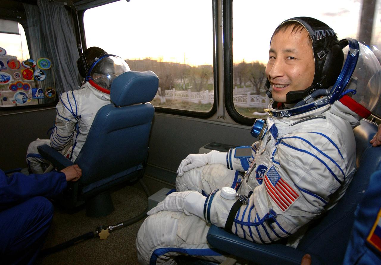 Baikonur Cosmodrome, Kazakhstan -- Astronaut Edward T. Lu, NASA ISS science officer and flight engineer for Expedition Seven, smiles for a photo during the bus ride to the launch pad. Lu and fellow crew member Cosmonaut Yuri I. Malenchenko, commander, were launched onboard a Soyuz rocket at 9:53 a.m. from Baikonur, Kazakhstan. Photo Credit: NASA/Bill Ingalls