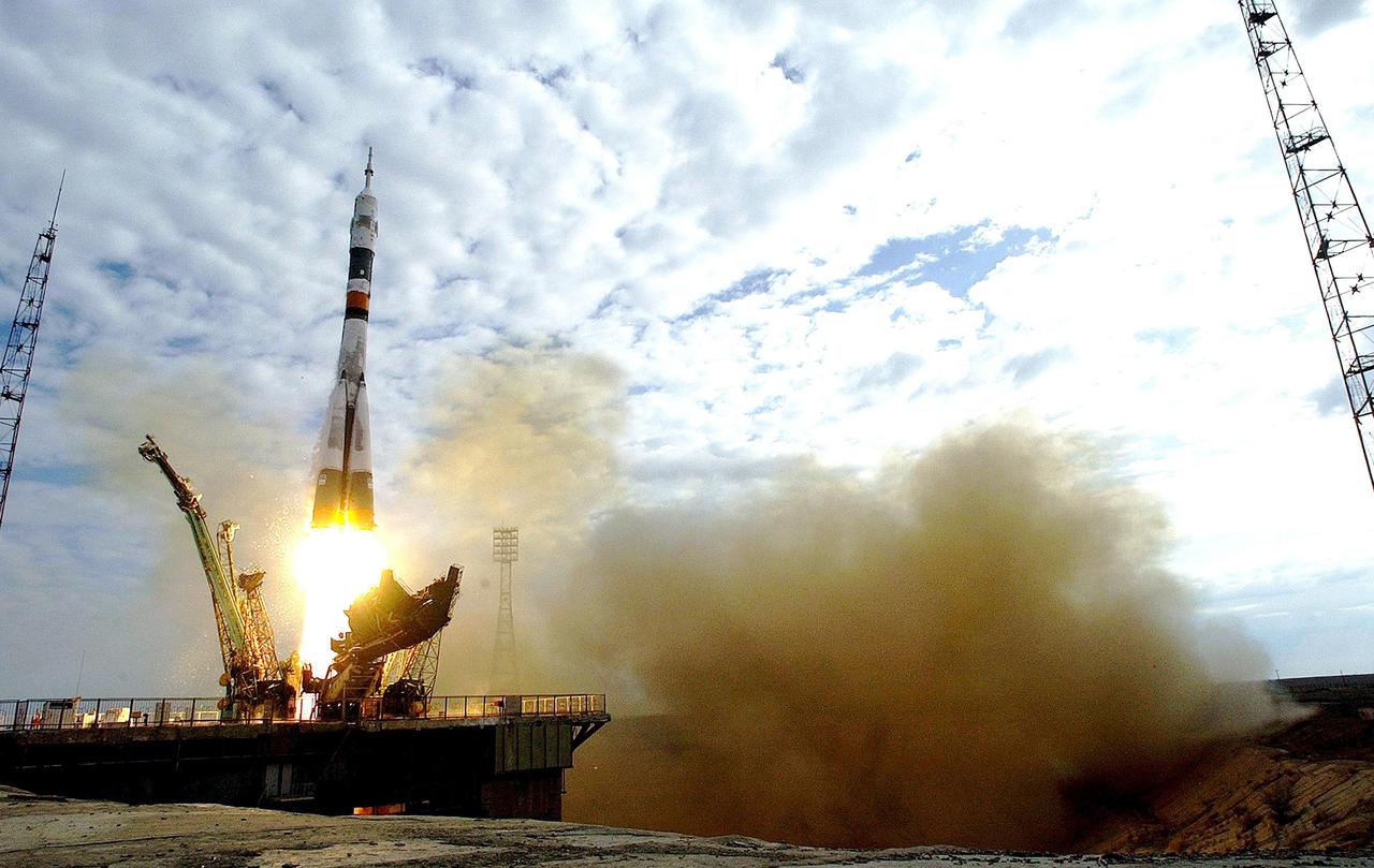 Baikonur Cosmodrome, Kazakhstan -- Astronaut Edward T. Lu, NASA ISS science officer and flight engineer for Expedition Seven, and Cosmonaut Yuri I. Malenchenko, commander, were launched onboard a Soyuz rocket at 9:53 a.m. from Baikonur, Kazakhstan.  Photo Credit: NASA/Scott Andrews