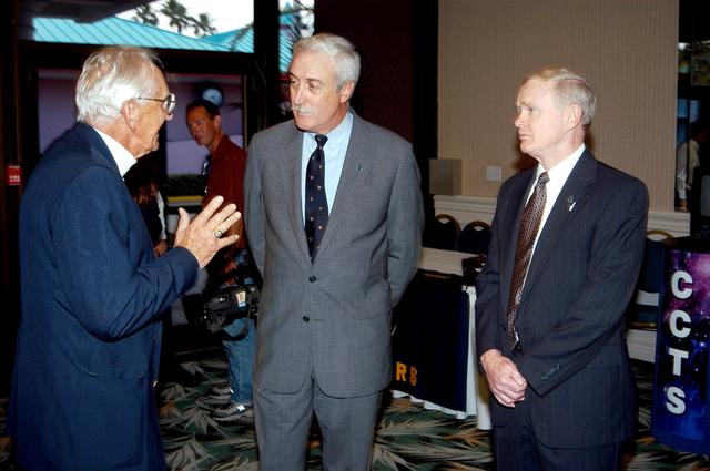 NASA image: KENNEDY SPACE CENTER, FLA. - Gunther Wendt (left), NASA retiree, holds the attention of NASA Administrator Sean O'Keefe (center) and Center Director Roy Bridges Jr. (right) at the annual Congressional Dinner hosted by the Florida Space Business Roundtable.  The dinner kicked off the annual Space Congress, held April 28-May 1, 2003, in Cape Canaveral, Fla.  The theme for the event was "Linking the Past to the Future: A Celebration of Space" and commemorated the 40th anniversary of the Kennedy Space Center and the Centennial of Flight.