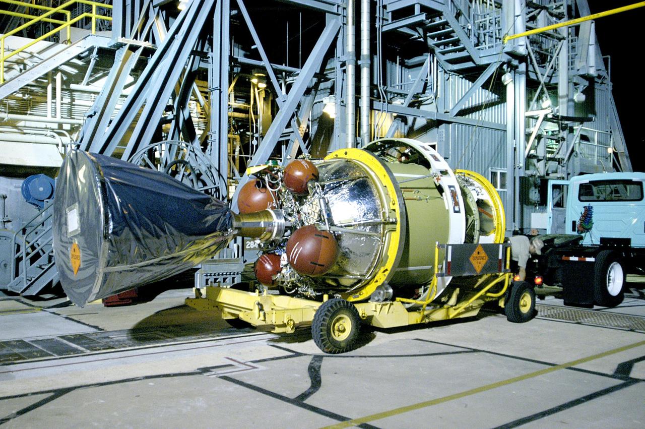 KENNEDY SPACE CENTER, FLA. -  The second stage of the Delta II rocket arrives at Pad 17-A, Cape Canaveral Air Force Station.  It will be mated to the first stage in preparation for the launch of the Mars Exploration Rover 2 (MER-A).  The MER Mission consists of two identical rovers designed to cover roughly 110 yards each Martian day over various terrain. Each rover will carry five scientific instruments that will allow it to search for evidence of liquid water that may have been present in the planet's past.  Identical to each other, the rovers will land at different regions of Mars.  Launch date for this first of NASA's two Mars Exploration Rover missions is scheduled June 5.