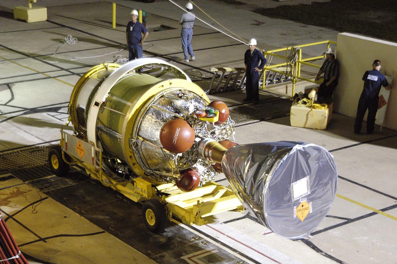 KENNEDY SPACE CENTER, FLA. - The second stage of the Delta II rocket arrives at Pad 17-A, Cape Canaveral Air Force Station.  It will be mated to the first stage in preparation for the launch of the Mars Exploration Rover 2 (MER-A).  The MER Mission consists of two identical rovers designed to cover roughly 110 yards each Martian day over various terrain. Each rover will carry five scientific instruments that will allow it to search for evidence of liquid water that may have been present in the planet's past.  Identical to each other, the rovers will land at different regions of Mars.  Launch date for this first of NASA's two Mars Exploration Rover missions is scheduled June 5.