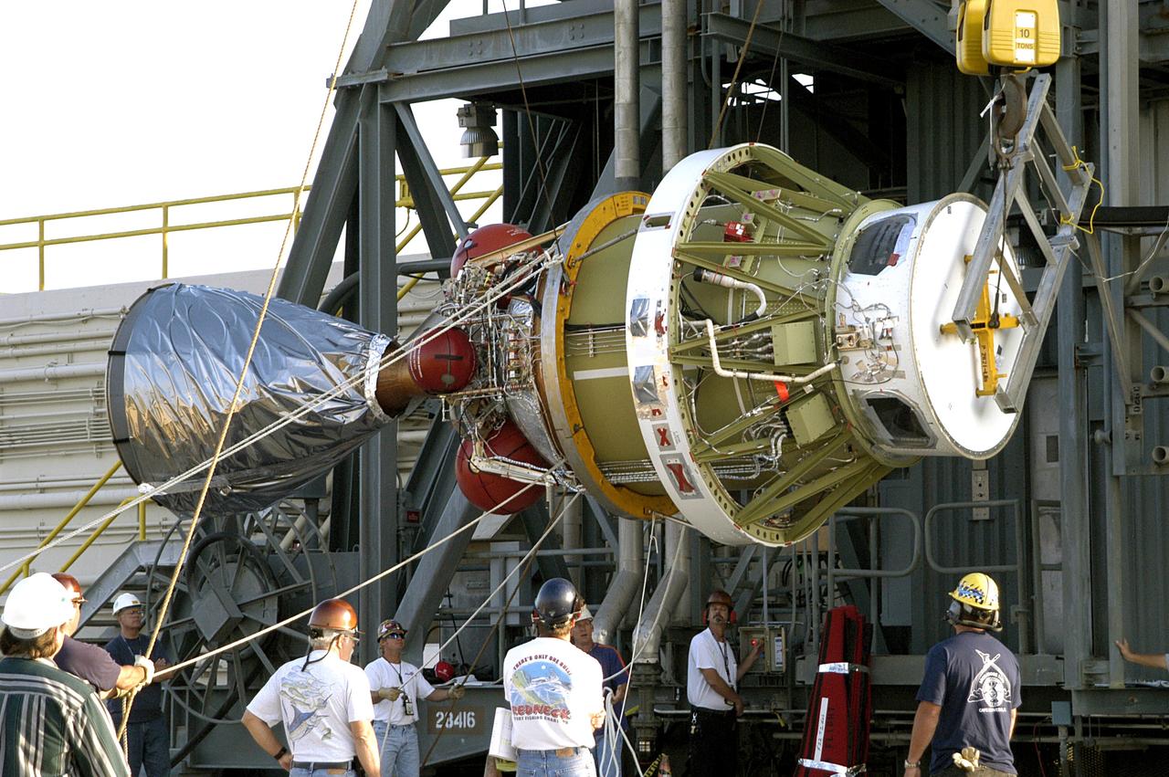 KENNEDY SPACE CENTER, FLA. - The second stage of the Delta II rocket is raised off the transporter for its lift up the launch tower on Pad 17-A, Cape Canaveral Air Force Station.  It will be mated to the first stage in preparation for the launch of the Mars Exploration Rover 2 (MER-A).  The MER Mission consists of two identical rovers designed to cover roughly 110 yards each Martian day over various terrain. Each rover will carry five scientific instruments that will allow it to search for evidence of liquid water that may have been present in the planet’s past.  Identical to each other, the rovers will land at different regions of Mars.  Launch date for this first of NASA’s two Mars Exploration Rover missions is scheduled June 5.