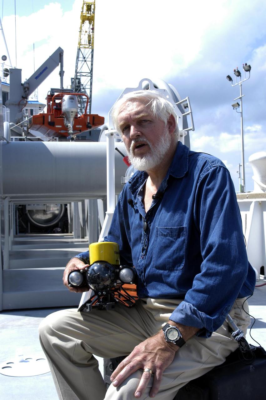 KENNEDY SPACE CENTER, FLA. - Onboard the Liberty Star, the NASA Space Shuttle support ship operated by United Space Alliance, .Dr. Grant Gilmore holds some of the equipment to be used on an undersea expedition. Gilmore is co-principle investigator of the Passive Acoustic Monitoring System (PAMS), part of the equipment. NASA/KSC is participating in the expedition to characterize the condition of the deep-sea coral reefs and reef fish populations in the Oculina Banks, a marine protected area, 20 miles offshore of the east coast of Florida. Scientists on the team will be deploying an underwater robot, a seafloor sampler, and the PAMS, originally developed by NASA to monitor the impact of rocket launches on wildlife refuge lagoons at KSC. The research is sponsored by NOAA Fisheries. The ship departed from Port Canaveral April 29 and will return May 9.