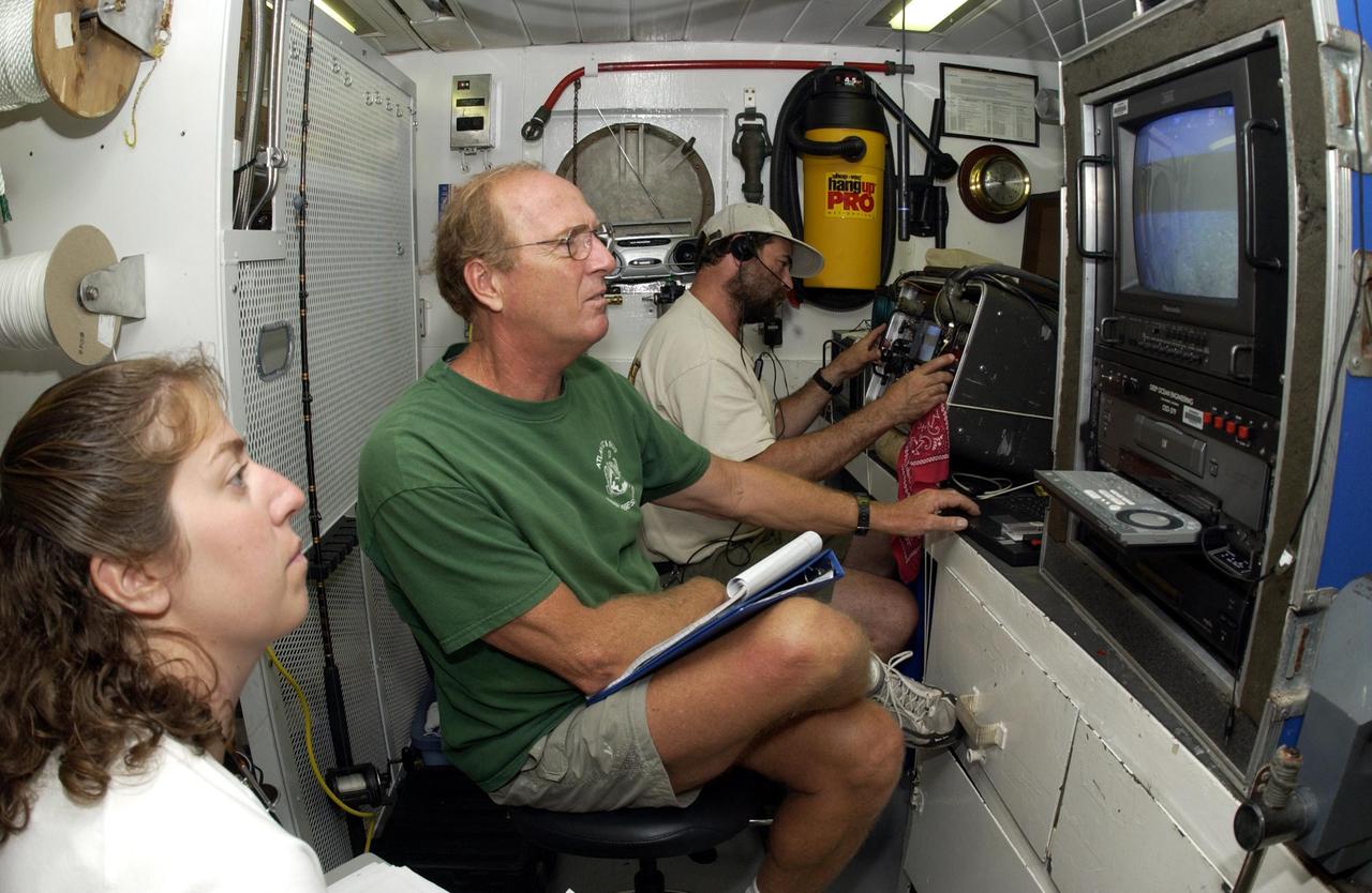 KENNEDY SPACE CENTER, FLA. - John Reed, co-principal investigator, Harbor Branch Oceanographic Institution, checks out equipment on the  Liberty Star, which will be the site of an undersea expedition to characterize the condition of the deep-sea coral reefs and reef fish populations in the Oculina Banks, a marine protected area, 20 miles offshore of the east coast of Florida.  He and other scientists will be deploying an underwater robot, a seafloor sampler, and the Passive Acoustic Monitoring System (PAMS).  Dr. Grant Gilmore was co-principle investigator of the PAMS,  originally developed by NASA to monitor the impact of rocket launches on wildlife refuge lagoons at KSC.   The research is sponsored by NOAA Fisheries.  The ship departed from Port Canaveral April 29 and will return May 9.