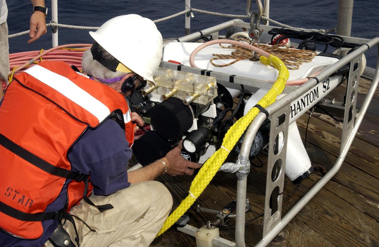 KENNEDY SPACE CENTER, FLA. -   Underwater equipment is checked on the deck of the Liberty Star, which will be the site of an undersea expedition to characterize the condition of the deep-sea coral reefs and reef fish populations in the Oculina Banks, a marine protected area, 20 miles offshore of the east coast of Florida.  A team of scientists will deploy an underwater robot, a seafloor sampler, and the Passive Acoustic Monitoring System (PAMS), originally developed by NASA to monitor the impact of rocket launches on wildlife refuge lagoons at KSC.   The research is sponsored by NOAA Fisheries.  The ship departed from Port Canaveral April 29 and will return May 9.