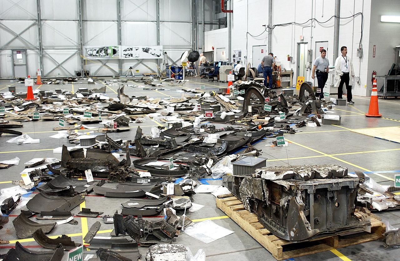 KENNEDY SPACE CENTER, FLA. - Pieces of Columbia debris in the RLV Hangar at KSC crowd the floor.  The final shipment of debris arrived on this date - recovery efforts have been concluded in East Texas.  Prior to this final shipment, the total number of items at KSC is 82,567, weighing 84,800 pounds or 38 percent of the total dry weight of Columbia.  Of those items, 78,760 have been identified, with 753 placed on the left wing grid in the RLV Hangar.