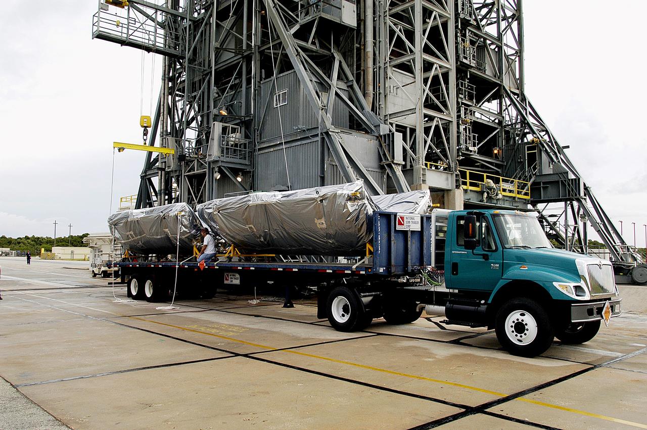 KENNEDY SPACE CENTER, FLA. -  The fairing for the Mars Exploration Rover 2 (MER-2/MER-A) arrives at Launch Complex 17-A, Cape Canaveral Air Force Station.  It will be installed around the payload for protection during launch.  The MER Mission consists of two identical rovers designed to cover roughly 110 yards each Martian day over various terrain. Each rover will carry five scientific instruments that will allow it to search for evidence of liquid water that may have been present in the planet's past.  Identical to each other, the rovers will land at different regions of Mars.  Launch date for MER-A  is scheduled for June 5.