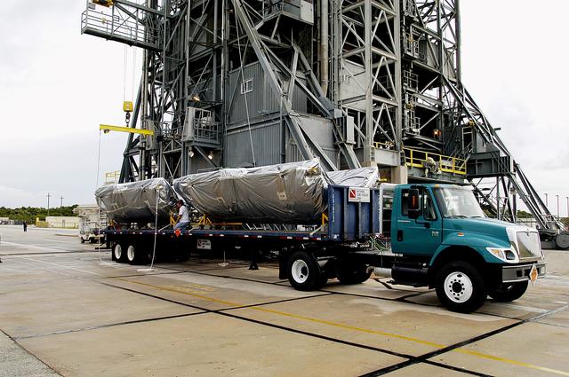 NASA image: KENNEDY SPACE CENTER, FLA. -  The fairing for the Mars Exploration Rover 2 (MER-2/MER-A) arrives at Launch Complex 17-A, Cape Canaveral Air Force Station.  It will be installed around the payload for protection during launch.  The MER Mission consists of two identical rovers designed to cover roughly 110 yards each Martian day over various terrain. Each rover will carry five scientific instruments that will allow it to search for evidence of liquid water that may have been present in the planet's past.  Identical to each other, the rovers will land at different regions of Mars.  Launch date for MER-A  is scheduled for June 5.