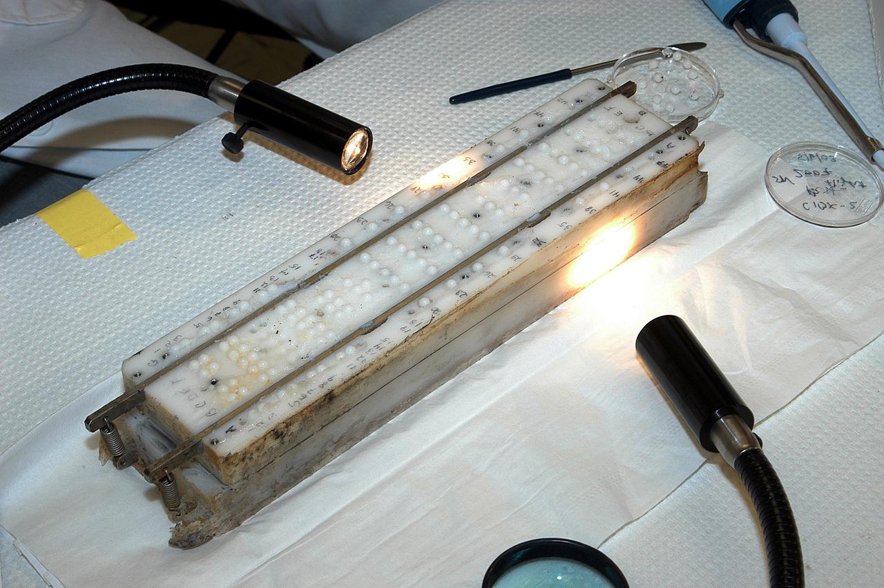 KENNEDY SPACE CENTER, FLA. - The apparatus shown was designed to hold microcapsules for research on mission STS-107.  It is one over several  included in the Commercial ITA Biomedical Experiments payload.  The box was recently recovered during the search for Columbia debris.  The drug delivery system and spaceflight hardware was developed jointly by JSC, the Institute for Research Inc. and Instrumentation Technology Associates Inc. to conduct microencapsulation experiments under microgravity conditions.