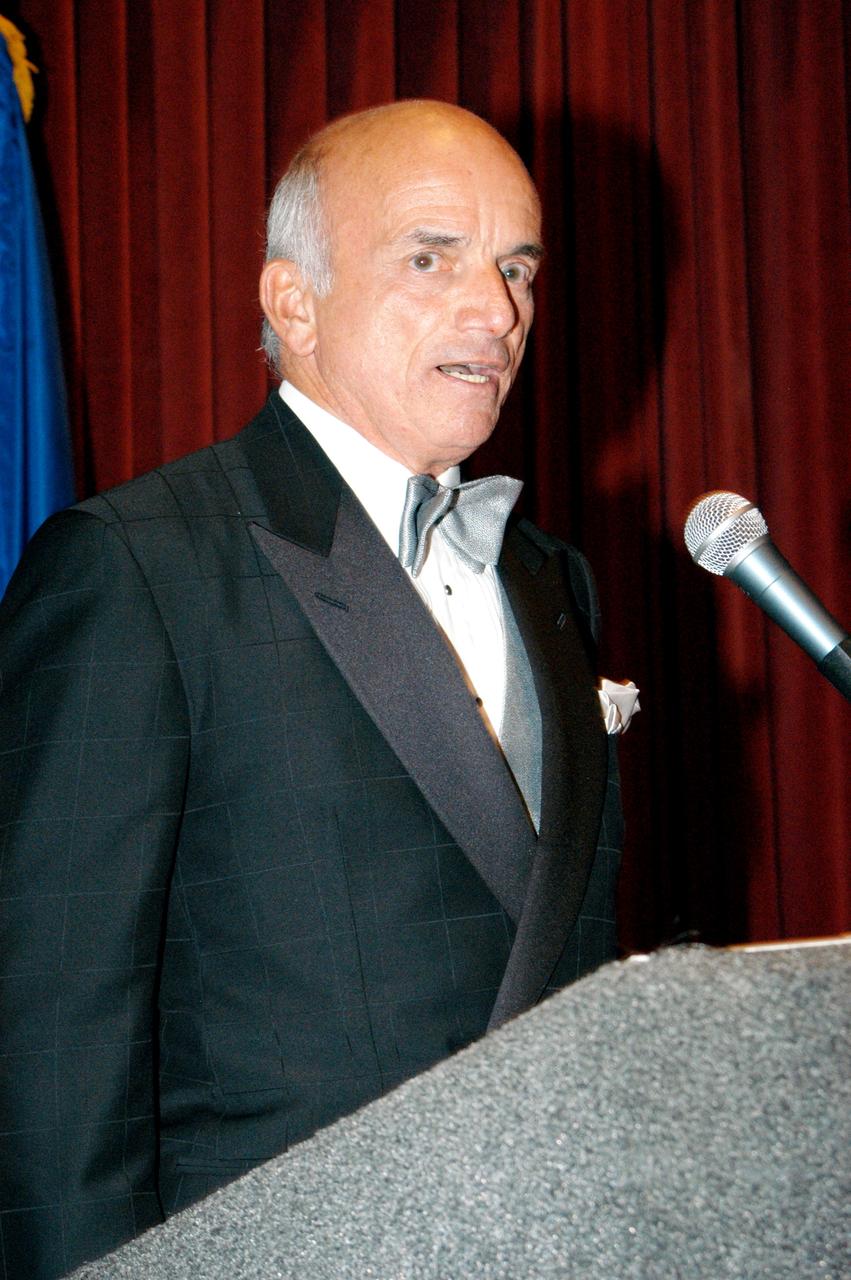 KENNEDY SPACE CENTER, FLA. - Dennis Tito, the first private citizen to visit the International Space Station, shares his experiences during the Space Congress Gala.  Held April 29-May 2, 2003, in Cape Canaveral, Fla., the Space Congress is an international conference that gathers attendees from the scientific community, the space industry workforce, educators and local supporting industries.  This year's event commemorated the 40th anniversary of the Kennedy Space Center and the Centennial of Flight.  The theme for the Space Congress was "Linking the Past to the Future: A Celebration of Space."