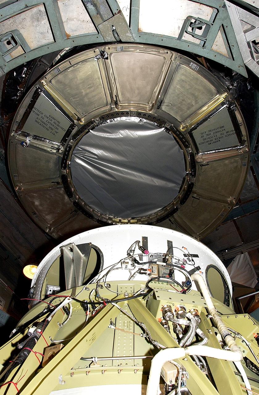 KENNEDY SPACE CENTER, FLA. -  On Launch Complex 17-B, Cape Canaveral Air Force Station, the Space Infrared Telescope Facility (SIRTF) observatory is being dismantled  from atop the Delta II rocket.  It will be taken back to NASA Spacecraft Hangar AE. SIRTF will remain in the clean room at Hangar AE until it returns to the pad in early August.