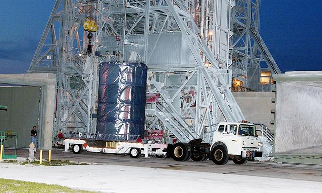 NASA image: KENNEDY SPACE CENTER, FLA. - On Launch Complex 17-B, Cape Canaveral Air Force Station, the Space Infrared Telescope Facility (SIRTF) observatory is on a transporter to be taken back to NASA Spacecraft Hangar AE. SIRTF will remain in the clean room at Hangar AE until it returns to the pad in early August.