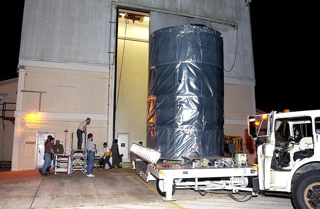 NASA image: KENNEDY SPACE CENTER, FLA. -  On Launch Complex 17-B, Cape Canaveral Air Force Station, the Space Infrared Telescope Facility (SIRTF) observatory is on a transporter to be taken back to NASA Spacecraft Hangar AE. SIRTF will remain in the clean room at Hangar AE until it returns to the pad in early August.