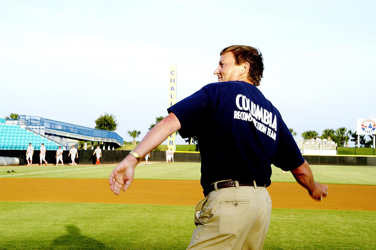 KENNEDY SPACE CENTER, FLA. - Shuttle Launch Director Mike Leinbach throws out the first pitch at a local baseball game at Manatees Stadium.  KSC employees were hosted by the Brevard Manatees, a minor league baseball team in Central Florida.   Before the game, attendees offered a moment of silence to honor the STS-107 crew and two recovery workers who died in a helicopter crash.