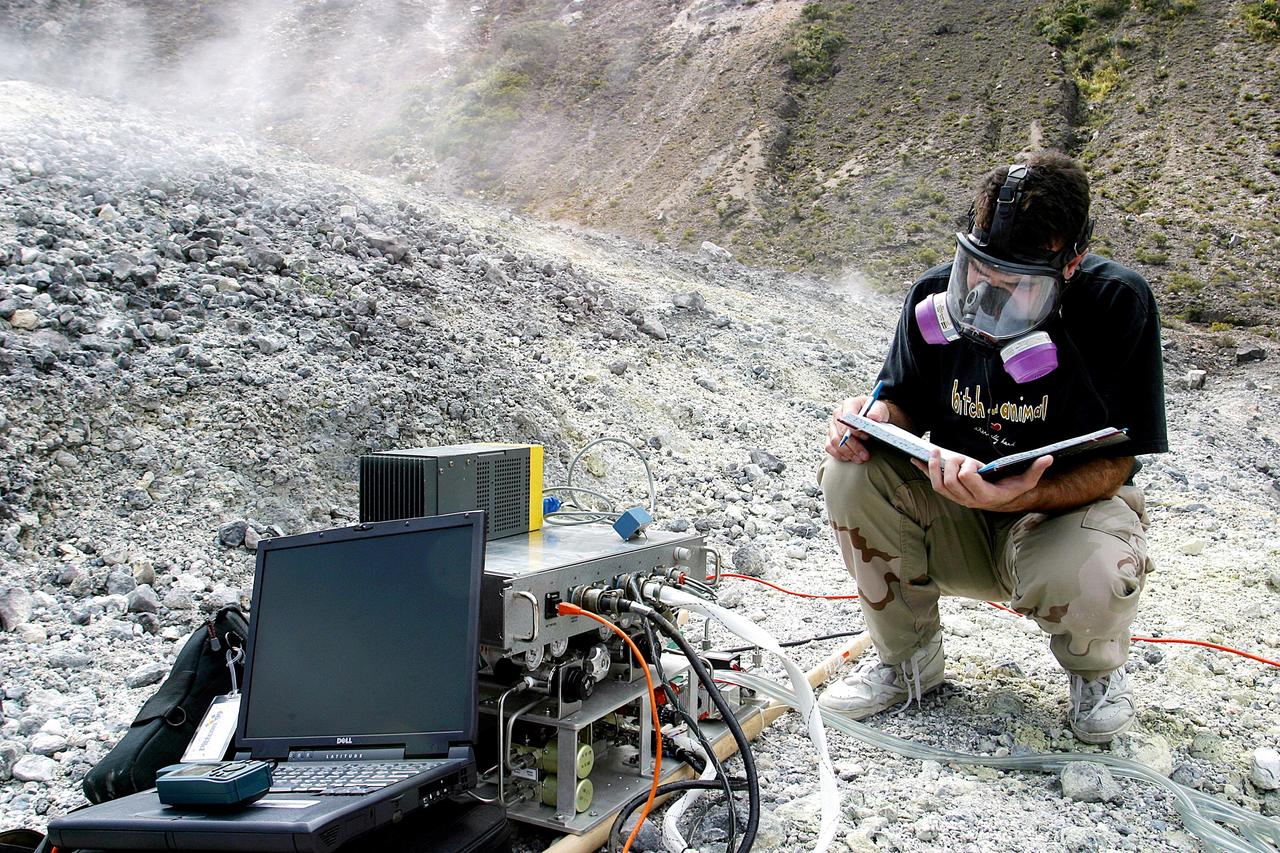 KENNEDY SPACE CENTER, FLA. - Dr. Richard Arkin records data as the hazardous gas detection system AVEMS is used to analyze the toxic gases produced by active vents, called fumaroles, in the Turrialba volcano in Costa Rica.  He is using the Aircraft-based Volcanic Emission Mass Spectrometer (AVEMS) that determines the presence and concentration of various chemicals.  The AVEMS system has been developed for use in the Space Shuttle program, to detect toxic gas leaks and emissions in the Shuttle’s aft compartment and the crew compartment.