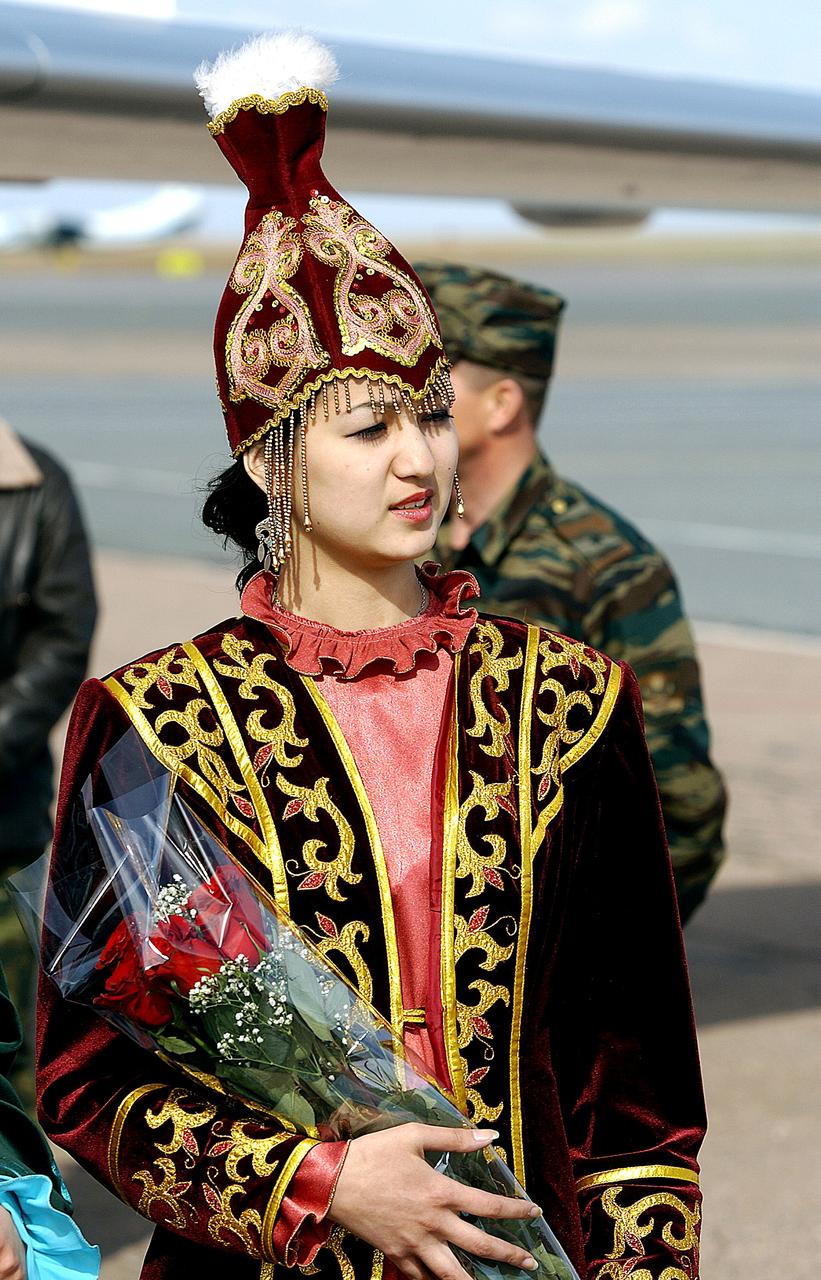 ASTANA, KAZAKHSTAN - One of three local Kazakh girls who were on hand at the Astana airport to welcome the Expedition Six crew with roses after the crew landed on the Kazakh Steppe in their Soyuz capsule. The Expedition Six crew spent 161 days in space, 159 manning the International Space Station. Photo Credit: NASA/Bill Ingalls
