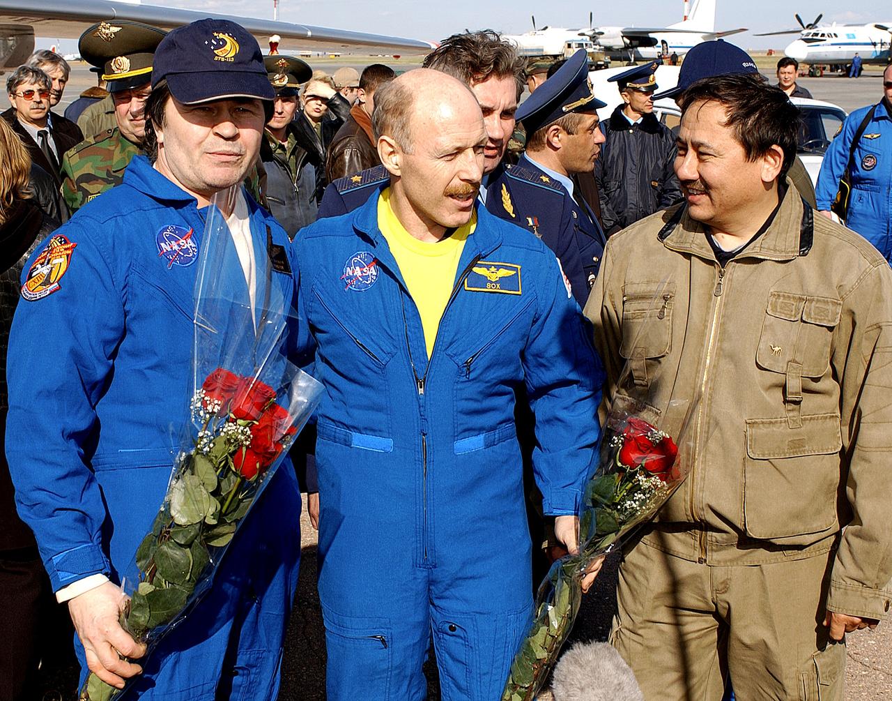 ASTANA, KAZAKHSTAN - Expedition Six Commander Ken Bowersox (center), Flight Engineer Nikolai Budarin (left) and NASA ISS Science Officer Don Pettit (not pictured) are welcomed to Kazakhstan by Cosmonaut Talgat Musabayev. The Expedition Six Soyuz capsule landed in Kazakhstan. The Expedition Six crew spent 161 days in space, 159 manning the International Space Station. Photo Credit: NASA/Bill Ingalls