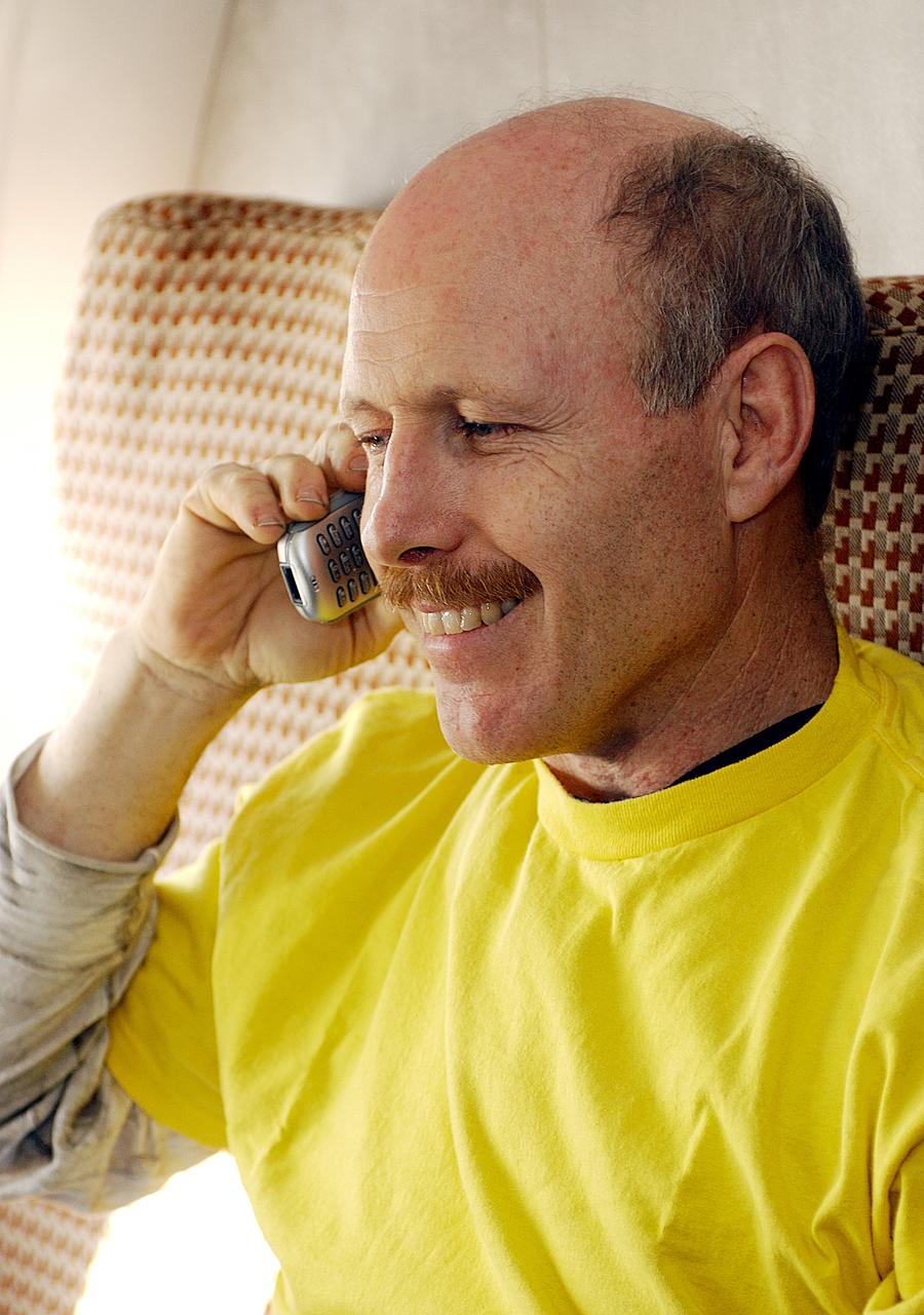 KAZAKHSTAN - Expedition Six Commander Ken Bowersox calls his wife Annie from the airplane prior to departure from Astana, Kazakhstan, to Moscow. The Expedition Six crew spent 161 days in space, 159 manning the International Space Station. Photo Credit: NASA/Bill Ingalls