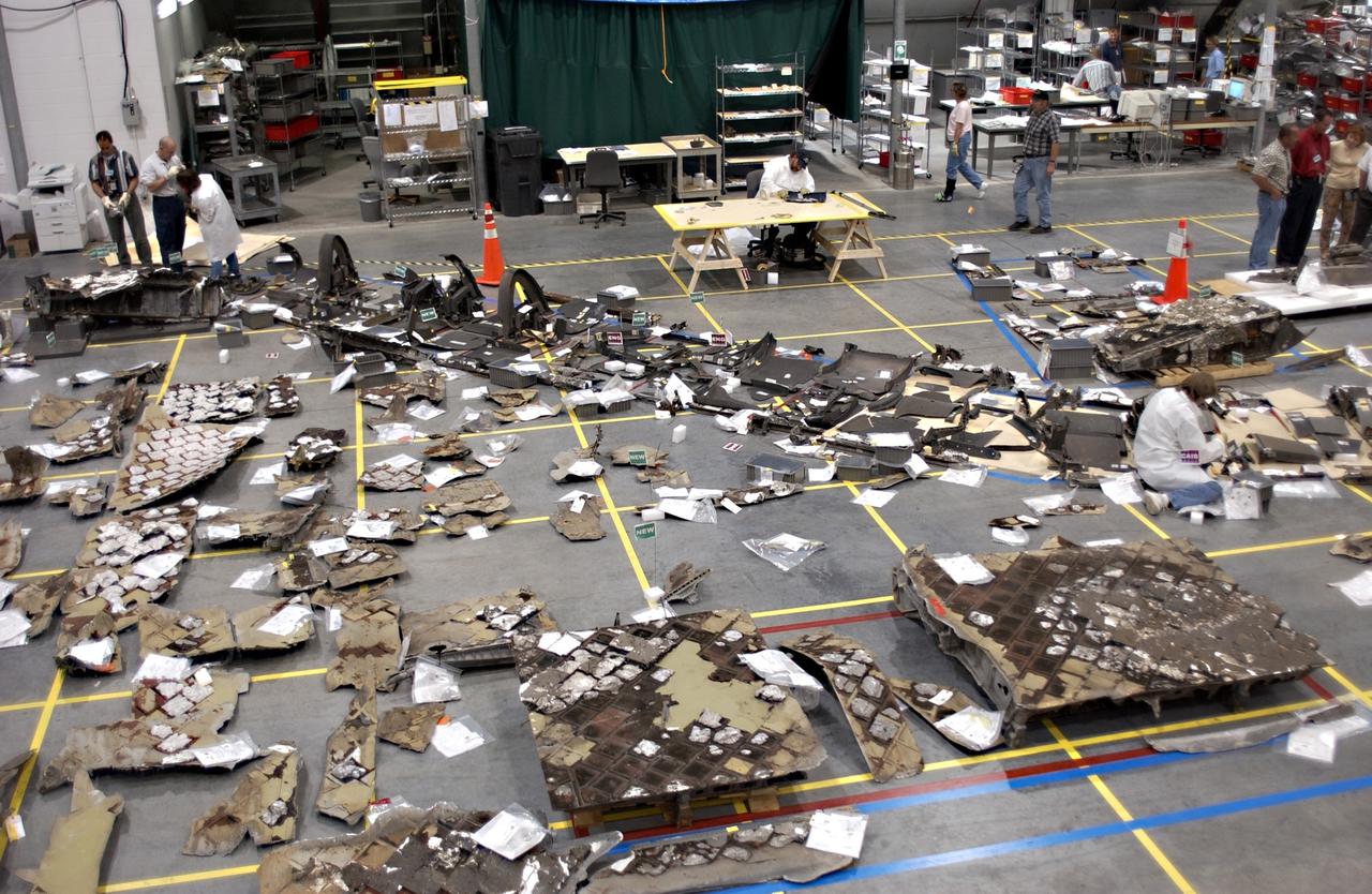 KENNEDY SPACE CENTER, FLA. -  Pieces of debris from Columbia are filling the floor of the RLV Hangar.  The items at KSC number more than 82,000, weigh 84,800 pounds or 38 percent of the total dry weight of Columbia.  Of those items, 78,760 have been identified, with 753 placed on the left wing grid in the hangar.