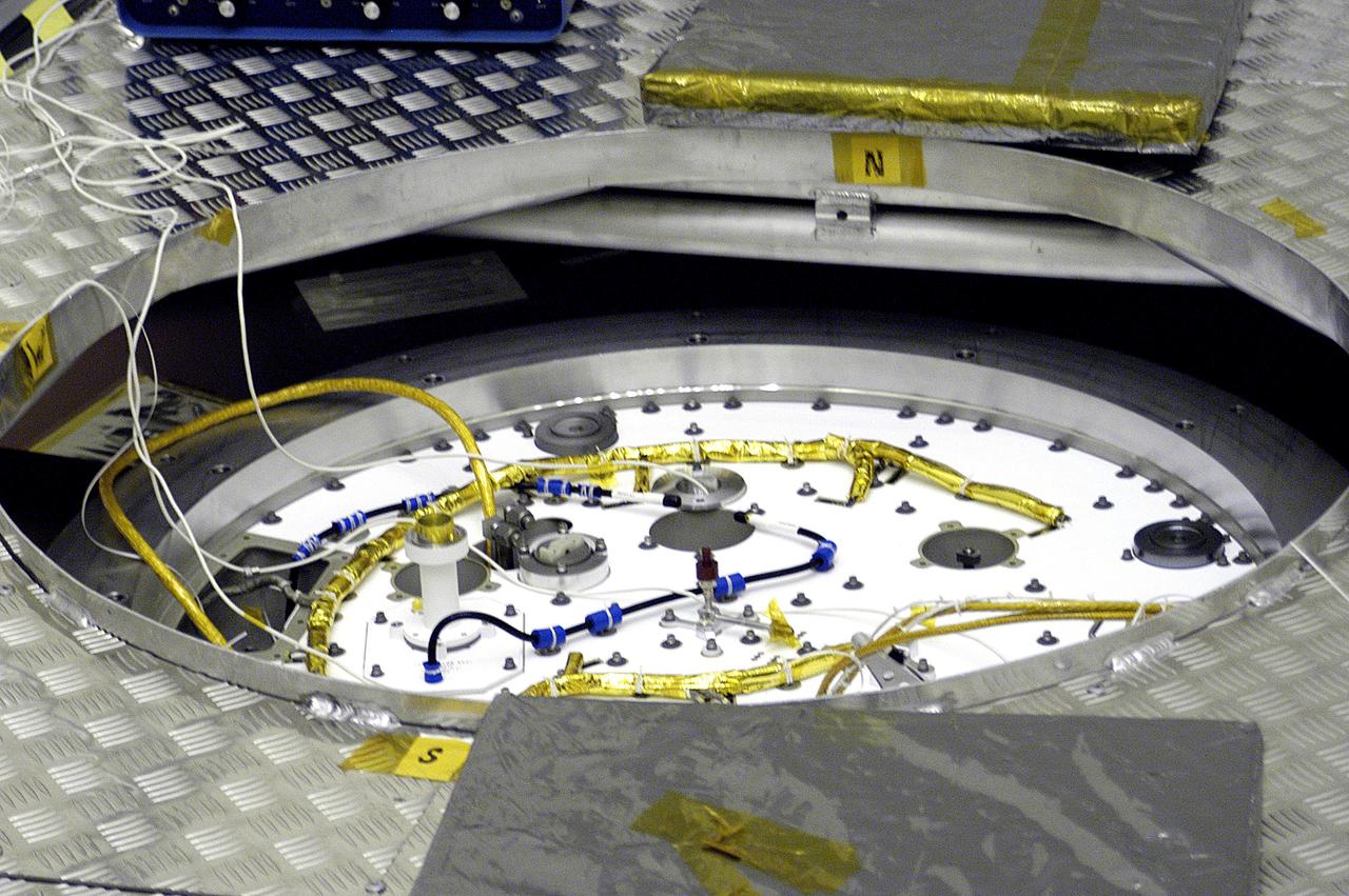 KENNEDY SPACE CENTER, FLA. - A closeup of the cruise stage to be mated to the Mars Exploration Rover 2 (MER-2) entry vehicle.    The cruise stage includes fuel tanks, thruster clusters and avionics for steering and propulsion.  NASA's twin Mars Exploration Rovers are designed to study the history of water on Mars. These robotic geologists are equipped with a robotic arm, a drilling tool, three spectrometers, and four pairs of cameras that allow them to have a human-like, 3D view of the terrain. Each rover could travel as far as 100 meters in one day to act as Mars scientists' eyes and hands, exploring an environment where humans can't yet go.  MER-2 is scheduled to launch June 5 as MER-A aboard a Delta rocket from Cape Canaveral Air Force Station.