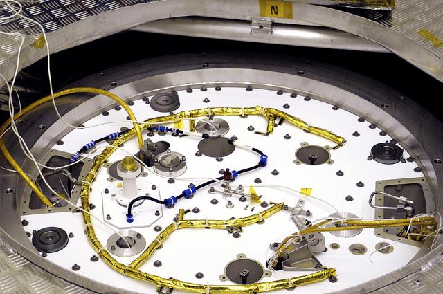 NASA image: KENNEDY SPACE CENTER, FLA. - A closeup of the cruise stage to be mated to the Mars Exploration Rover 2 (MER-2) entry vehicle.    The cruise stage includes fuel tanks, thruster clusters and avionics for steering and propulsion.  NASA's twin Mars Exploration Rovers are designed to study the history of water on Mars. These robotic geologists are equipped with a robotic arm, a drilling tool, three spectrometers, and four pairs of cameras that allow them to have a human-like, 3D view of the terrain. Each rover could travel as far as 100 meters in one day to act as Mars scientists' eyes and hands, exploring an environment where humans can't yet go.  MER-2 is scheduled to launch June 5 as MER-A aboard a Delta rocket from Cape Canaveral Air Force Station.