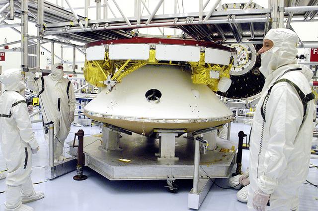 NASA image: KENNEDY SPACE CENTER, FLA. -  The Mars Exploration Rover 2 (MER-2) undergoes a weight and center of gravity determination in the Payload Hazardous Servicing Facility.  NASA's twin Mars Exploration Rovers are designed to study the history of water on Mars. These robotic geologists are equipped with a robotic arm, a drilling tool, three spectrometers, and four pairs of cameras that allow them to have a human-like, 3D view of the terrain. Each rover could travel as far as 100 meters in one day to act as Mars scientists' eyes and hands, exploring an environment where humans can't yet go.  Launch of MER-2 is scheduled for June 5 from Cape Canaveral Air Force Station.