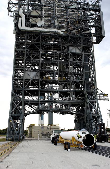 NASA image: KENNEDY SPACE CENTER, FLA. - A solid rocket booster arrives at Launch Complex 17-A, Cape Canaveral Air Force Station.  It is one of nine that will be mated to the Delta rocket to launch Mars Exploration Rover 2. NASA’s twin Mars Exploration Rovers are designed to study the history of water on Mars. These robotic geologists are equipped with a robotic arm, a drilling tool, three spectrometers, and four pairs of cameras that allow them to have a human-like, 3D view of the terrain. Each rover could travel as far as 100 meters in one day to act as Mars scientists' eyes and hands, exploring an environment where humans can’t yet go.  MER-2 is scheduled to launch June 5 as MER-A.  MER-1 (MER-B) will launch June 25.