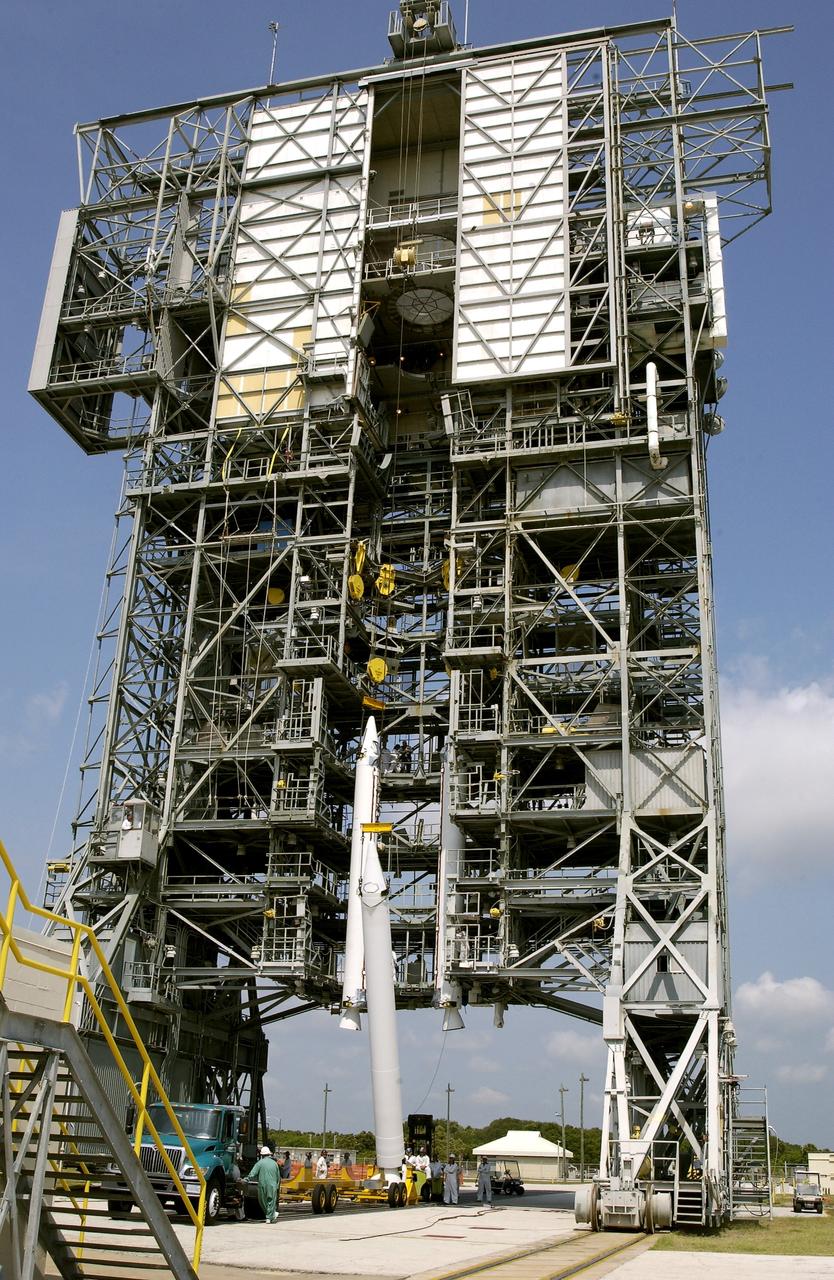 KENNEDY SPACE CENTER, FLA. - A third solid rocket booster (SRB) is lifted up the launch tower on Launch Complex 17-A, Cape Canaveral Air Force Station.  They are three of nine SRBs that will be mated to the Delta rocket to launch Mars Exploration Rover 2 (MER-2). NASA’s twin Mars Exploration Rovers are designed to study the history of water on Mars. These robotic geologists are equipped with a robotic arm, a drilling tool, three spectrometers, and four pairs of cameras that allow them to have a human-like, 3D view of the terrain. Each rover could travel as far as 100 meters in one day to act as Mars scientists' eyes and hands, exploring an environment where humans can’t yet go.  MER-2 is scheduled to launch June 5 as MER-A.  MER-1 (MER-B) will launch June 25.