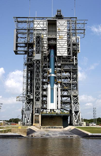 NASA image: KENNEDY SPACE CENTER, FLA. -  The Delta II rocket on Launch Complex 17-A, Cape Canaveral Air Force Station, is having solid rocket boosters (SRBs) installed that will help launch Mars Exploration Rover 2 (MER-2) on June 5.  In the center are three more solid rocket boosters that will be added to the Delta, which will carry nine in all.  NASA’s twin Mars Exploration Rovers are designed to study the history of water on Mars. These robotic geologists are equipped with a robotic arm, a drilling tool, three spectrometers, and four pairs of cameras that allow them to have a human-like, 3D view of the terrain. Each rover could travel as far as 100 meters in one day to act as Mars scientists' eyes and hands, exploring an environment where humans can’t yet go.  MER-2 is scheduled to launch as MER-A.  MER-1 (MER-B) will launch June 25.