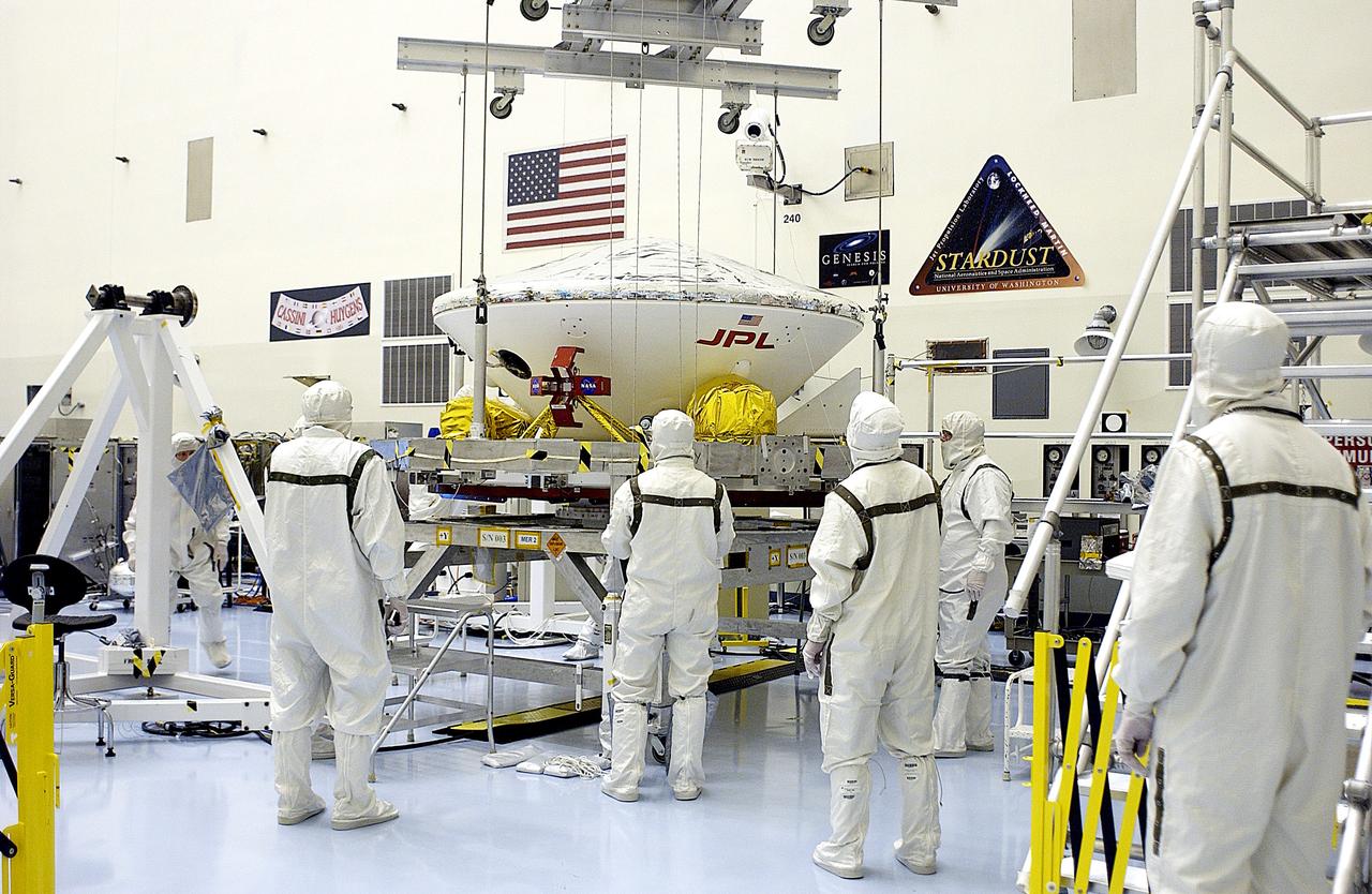 KENNEDY SPACE CENTER, FLA. - In the Payload Hazardous Servicing Facility, an overhead crane is lifting the Mars Exploration Rover 2 (MER-2) to move it to a spin table. NASA’s twin Mars Exploration Rovers are designed to study the history of water on Mars. These robotic geologists are equipped with a robotic arm, a drilling tool, three spectrometers, and four pairs of cameras that allow them to have a human-like, 3D view of the terrain. Each rover could travel as far as 100 meters in one day to act as Mars scientists' eyes and hands, exploring an environment where humans can’t yet go. The MER-2 is scheduled to launch June 5 from Launch Pad 17-A, Cape Canaveral Air Force Station.