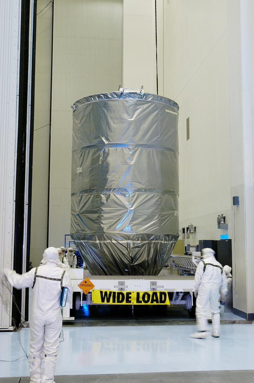 KENNEDY SPACE CENTER, FLA. -  The Delta II rocket’s third stage arrives at the Payload Hazardous Servicing Facility.  It will be mated with the Mars Exploration Rover 2 (MER-2) and then installed into the transportation canister for transfer to the launch pad.  NASA's twin Mars Exploration Rovers are designed to study the history of water on Mars. These robotic geologists are equipped with a robotic arm, a drilling tool, three spectrometers, and four pairs of cameras that allow them to have a human-like, 3D view of the terrain. Each rover could travel as far as 100 meters in one day to act as Mars scientists' eyes and hands, exploring an environment where humans can't yet go.  MER-2 is scheduled to launch June 5 as MER-A aboard a Delta II rocket from Cape Canaveral Air Force Station.