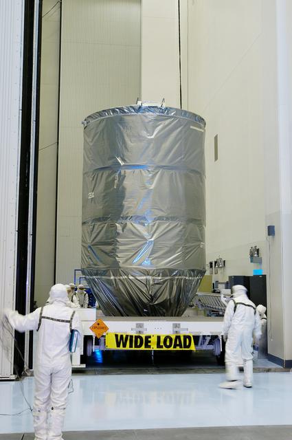 NASA image: KENNEDY SPACE CENTER, FLA. -  The Delta II rocket’s third stage arrives at the Payload Hazardous Servicing Facility.  It will be mated with the Mars Exploration Rover 2 (MER-2) and then installed into the transportation canister for transfer to the launch pad.  NASA's twin Mars Exploration Rovers are designed to study the history of water on Mars. These robotic geologists are equipped with a robotic arm, a drilling tool, three spectrometers, and four pairs of cameras that allow them to have a human-like, 3D view of the terrain. Each rover could travel as far as 100 meters in one day to act as Mars scientists' eyes and hands, exploring an environment where humans can't yet go.  MER-2 is scheduled to launch June 5 as MER-A aboard a Delta II rocket from Cape Canaveral Air Force Station.