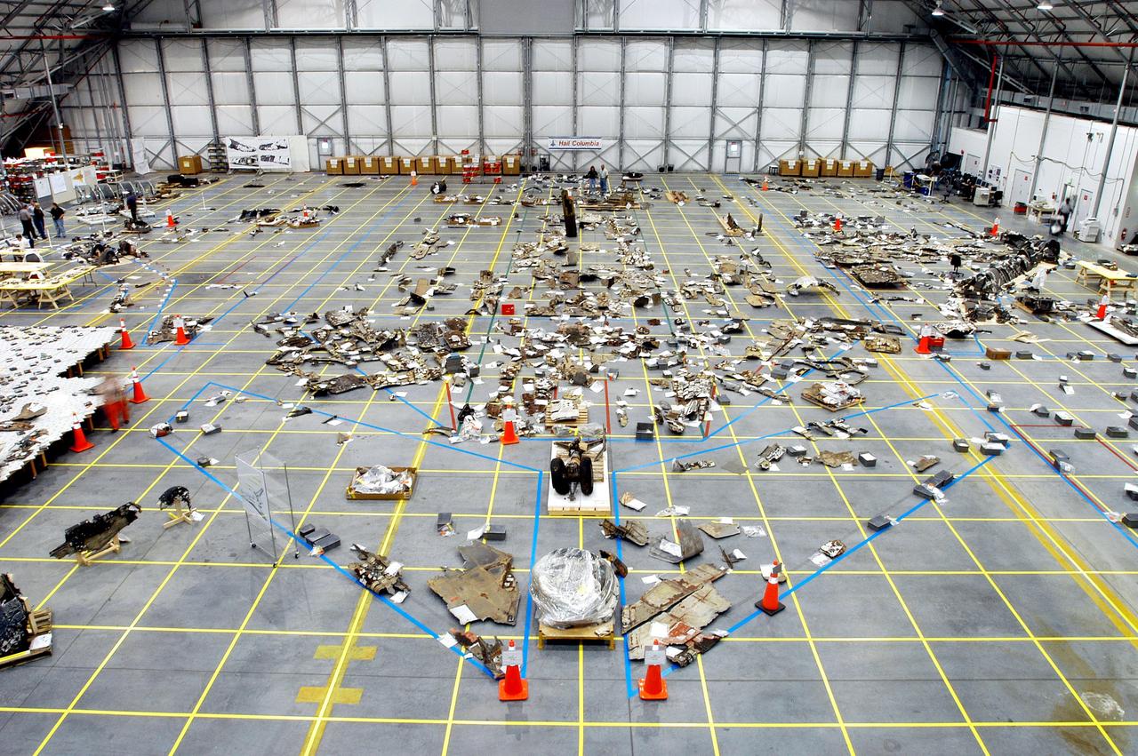 KENNEDY SPACE CENTER, FLA. - An overview of the Columbia debris hangar shows the orbiter outline on the floor with some of the 78,760 pieces identified to date.  More than 82,500 pieces of shuttle debris have been rcovered.
