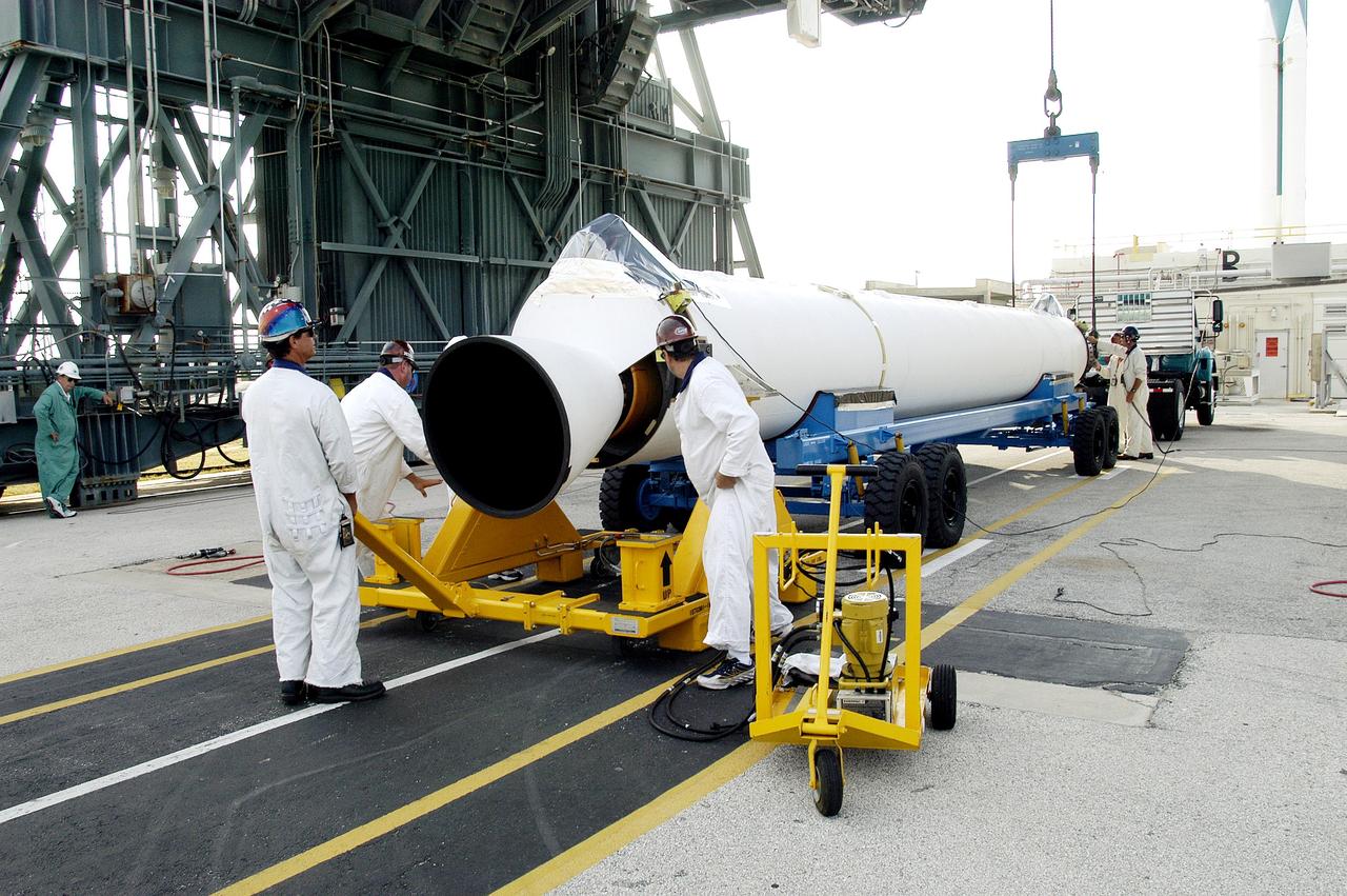 KENNEDY SPACE CENTER, FLA. -   A solid rocket booster arrives at Launch Complex 17-B, Cape Canaveral Air Force Station, to be mated to the Delta II rocket for the Mars Exploration Rover 1 (MER-1) launch June 25.  NASA’s twin Mars Exploration Rovers are designed to study the history of water on Mars. These robotic geologists are equipped with a robotic arm, a drilling tool, three spectrometers, and four pairs of cameras that allow them to have a human-like, 3D view of the terrain. Each rover could travel as far as 100 meters in one day to act as Mars scientists' eyes and hands, exploring an environment where humans can’t yet go.  MER-2 (MER-A) will launch June 5.