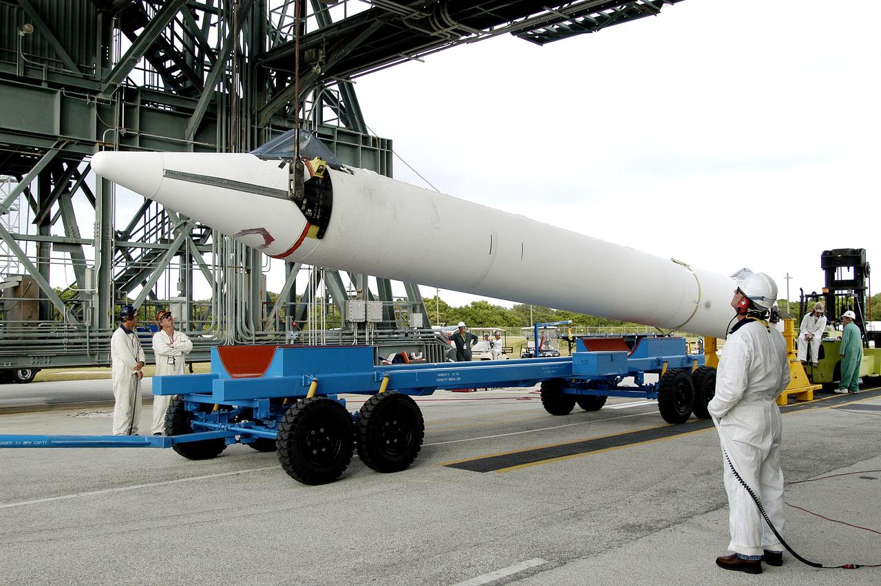 KENNEDY SPACE CENTER, FLA. - On Launch Complex 17-B, Cape Canaveral Air Force Station, a solid rocket booster is raised off  its transporter to lift it to vertical.  It will be mated to the Delta II rocket for the Mars Exploration Rover 1 (MER-1) launch June 25.  NASA’s twin Mars Exploration Rovers are designed to study the history of water on Mars. These robotic geologists are equipped with a robotic arm, a drilling tool, three spectrometers, and four pairs of cameras that allow them to have a human-like, 3D view of the terrain. Each rover could travel as far as 100 meters in one day to act as Mars scientists' eyes and hands, exploring an environment where humans can’t yet go. MER-2 (MER-A) will launch June 5.