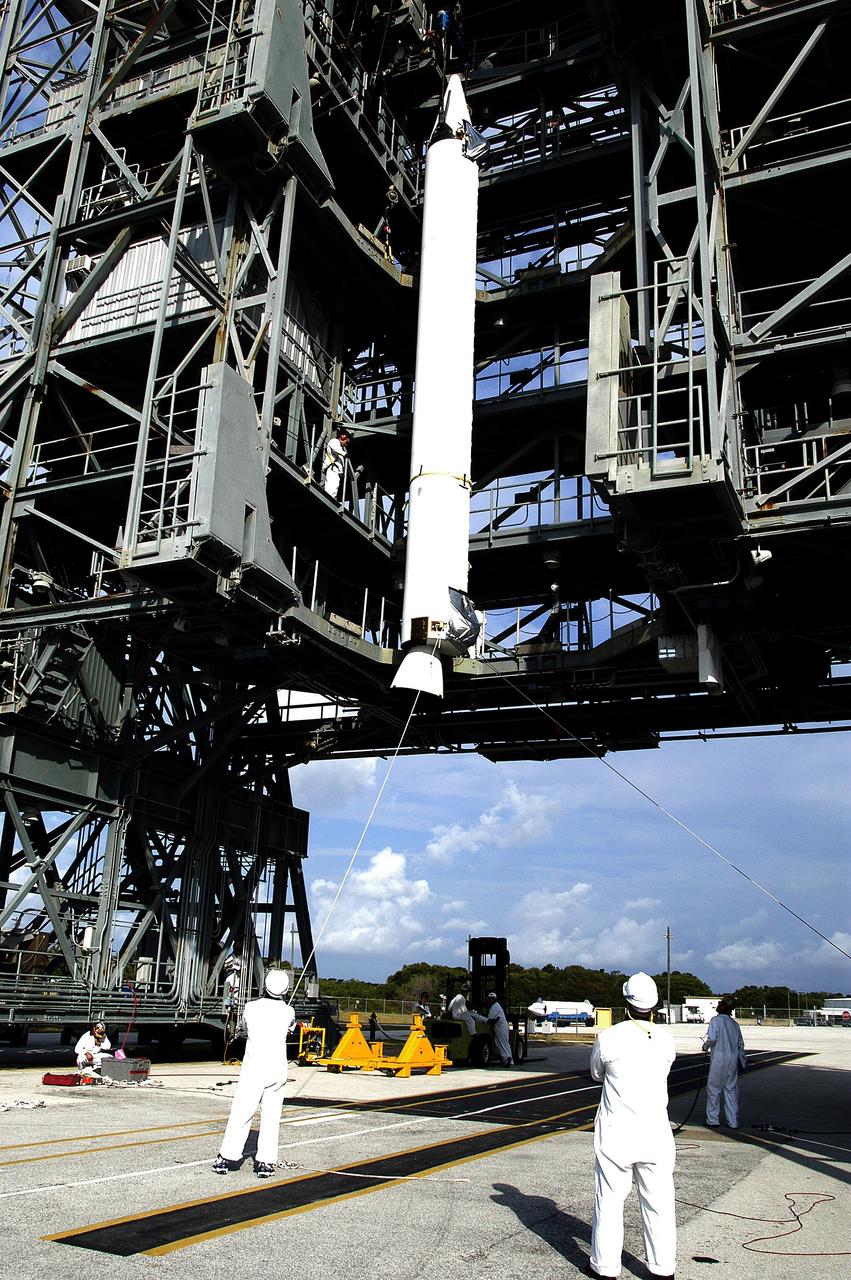 KENNEDY SPACE CENTER, FLA. - On Launch Complex 17-B, Cape Canaveral Air Force Station, a solid rocket booster if lifted up the launch tower.  It will be mated to the Delta II rocket for the Mars Exploration Rover 1 (MER-1) launch June 25.  NASA’s twin Mars Exploration Rovers are designed to study the history of water on Mars. These robotic geologists are equipped with a robotic arm, a drilling tool, three spectrometers, and four pairs of cameras that allow them to have a human-like, 3D view of the terrain. Each rover could travel as far as 100 meters in one day to act as Mars scientists' eyes and hands, exploring an environment where humans can’t yet go.  MER-2 (MER-A) will launch June 5.